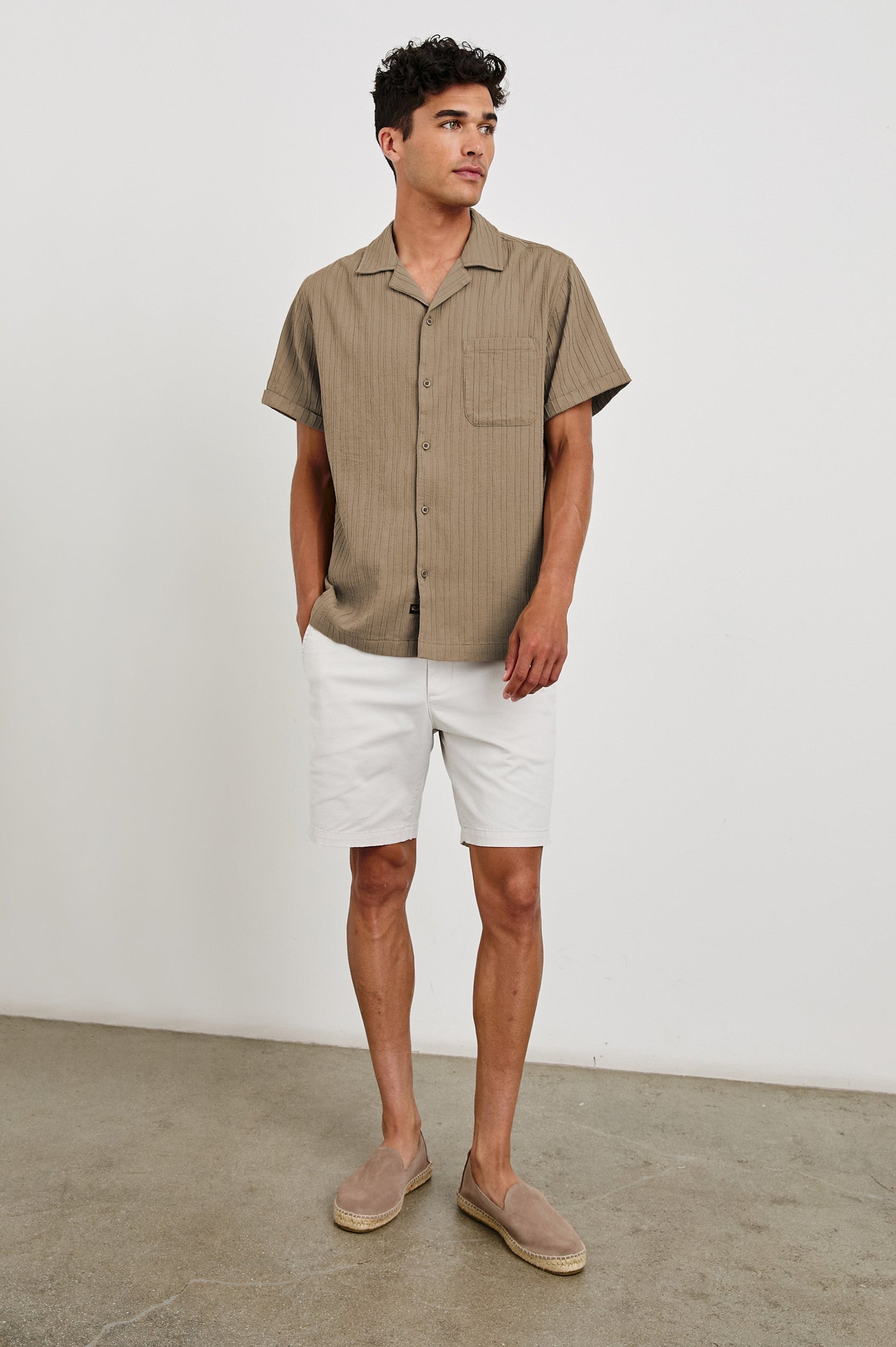 Ohana textured button up short sleeve shirt with collar and front chest pocket in Olive - full body front view on model