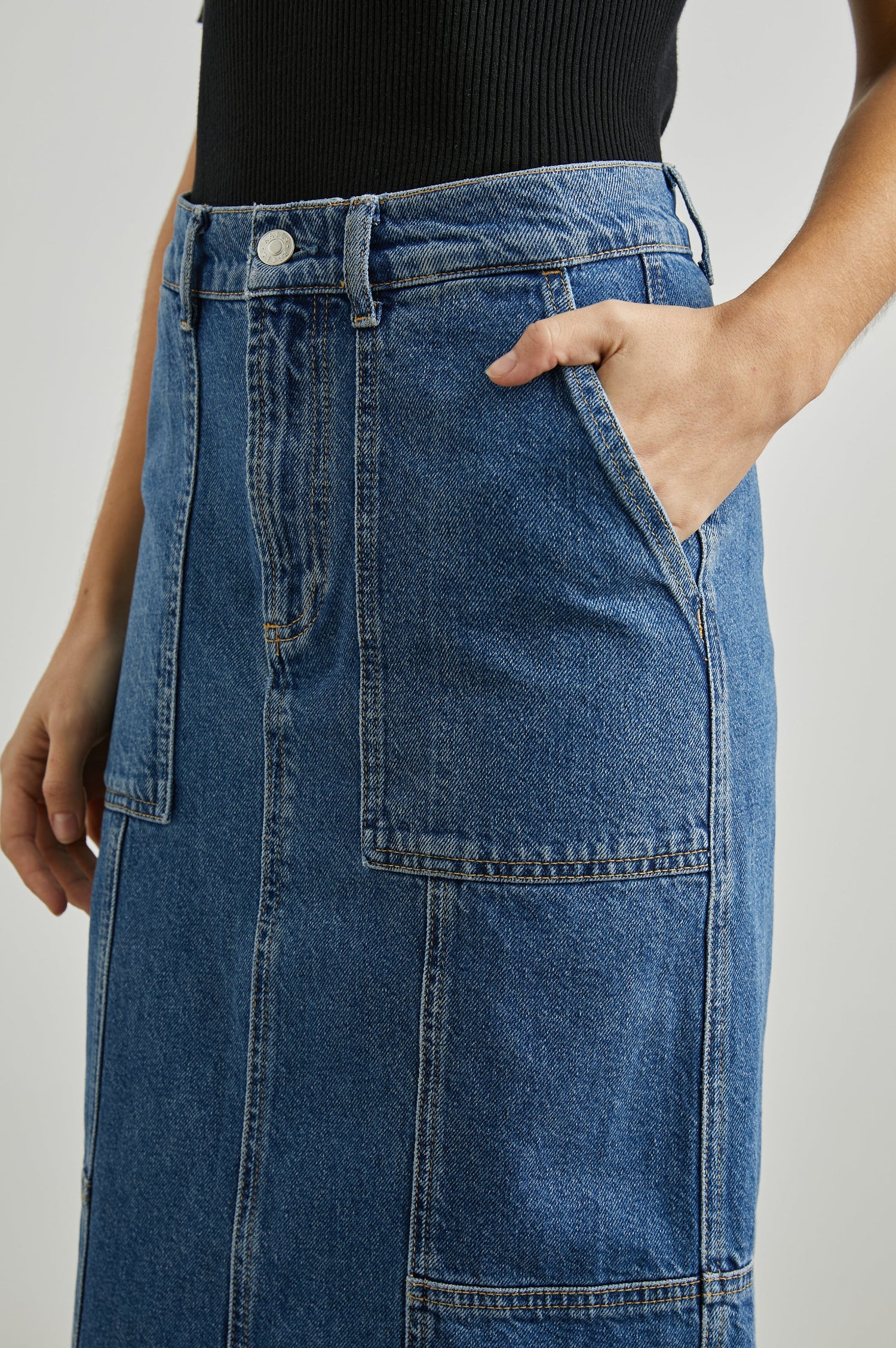 Olympic Midi Denim Skirt with Belt Loops, Additional Seams, Two Large Front Pockets and Two Back Welt Pockets in Sorrento Colorway, a Blue - Front View Featured on Model