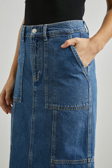 Olympic Midi Denim Skirt with Belt Loops, Additional Seams, Two Large Front Pockets and Two Back Welt Pockets in Sorrento Colorway, a Blue - Front View Featured on Model