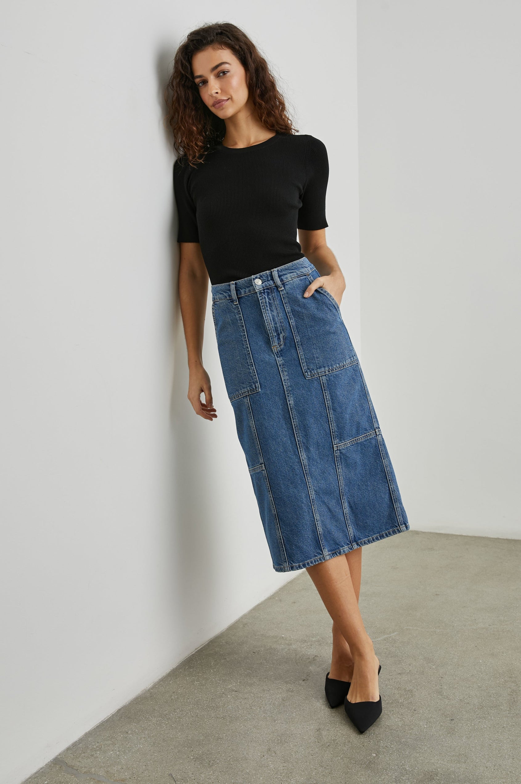 Olympic Midi Denim Skirt with Belt Loops, Additional Seams, Two Large Front Pockets and Two Back Welt Pockets in Sorrento Colorway, a Blue - Front Full Body View Featured on Model