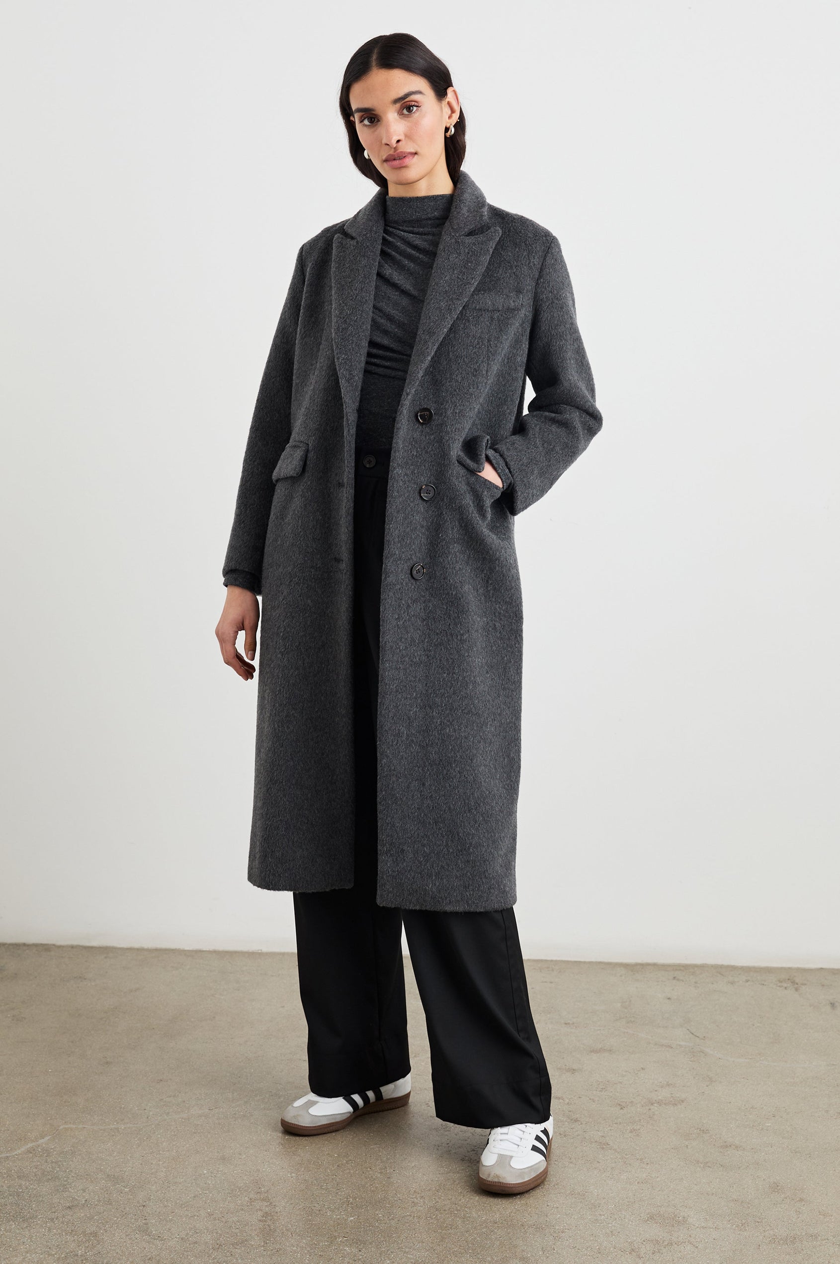 Opera Below-the-Knee Length Coat with V Neck, Three-Button Closure and Two Front Flap Patch Pockets in Charcoal Colorway - Front Full Body View Featured on Model