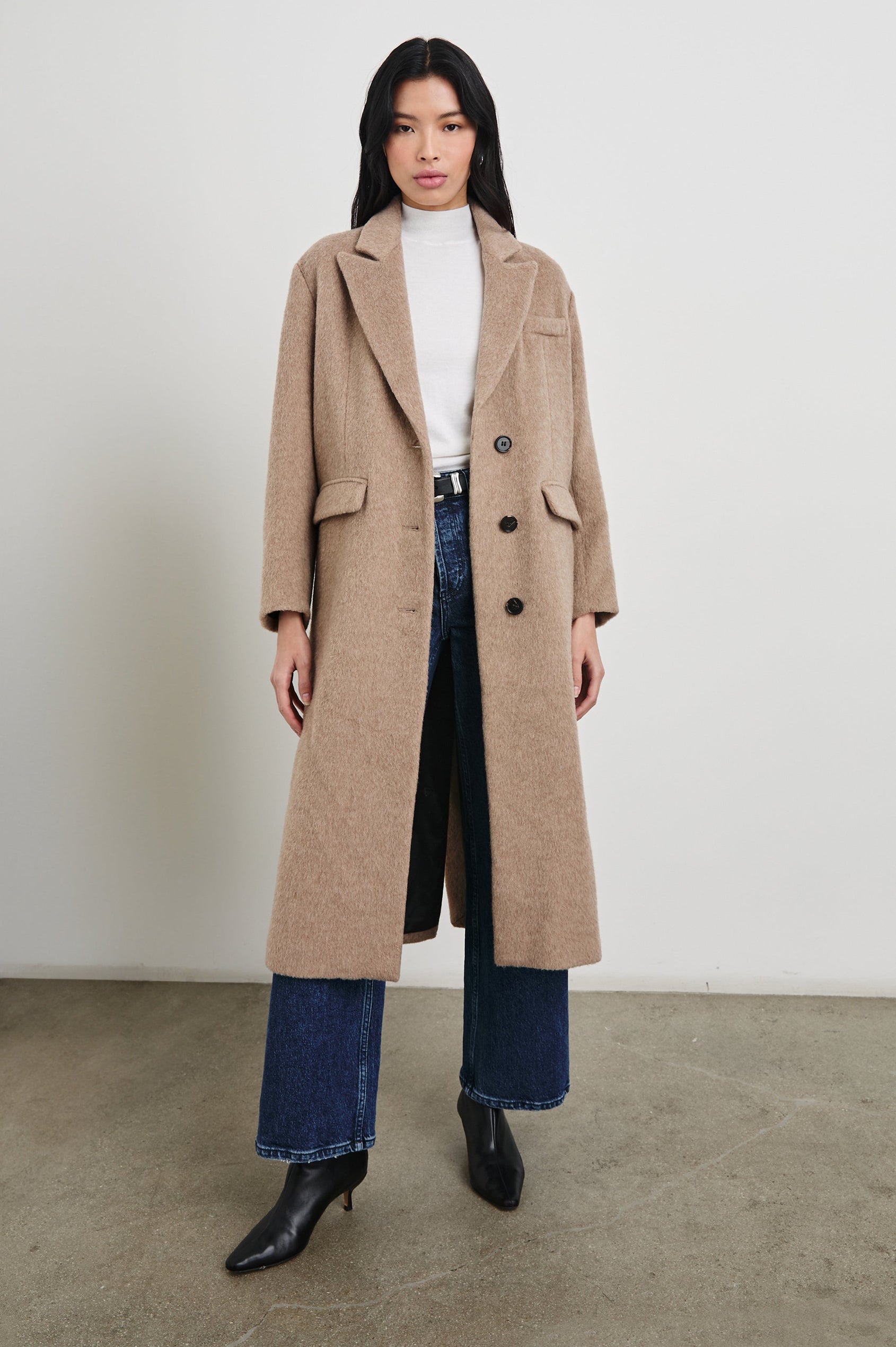 Opera Below-the-Knee Length Coat with V Neck, Three-Button Closure and Two Front Flap Patch Pockets in Heather Latte Colorway - Front Full Body View Featured on Model