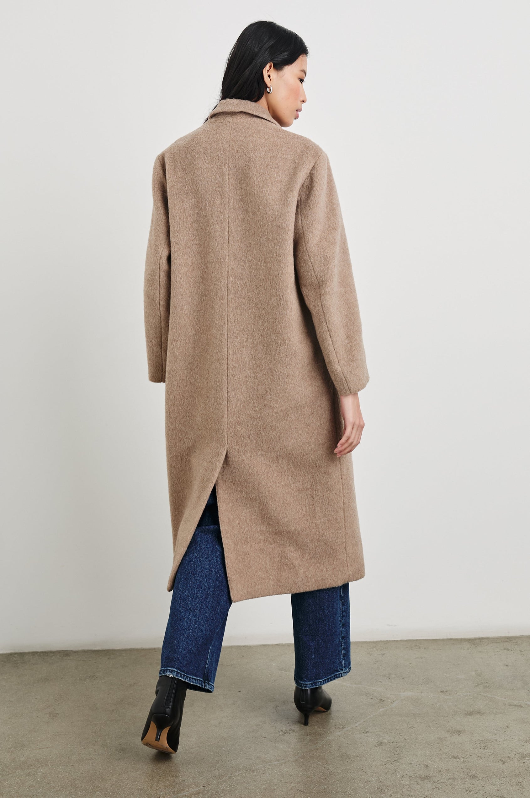 Opera Below-the-Knee Length Coat with V Neck, Three-Button Closure and Two Front Flap Patch Pockets in Heather Latte Colorway - Back Full Body View Featured on Model