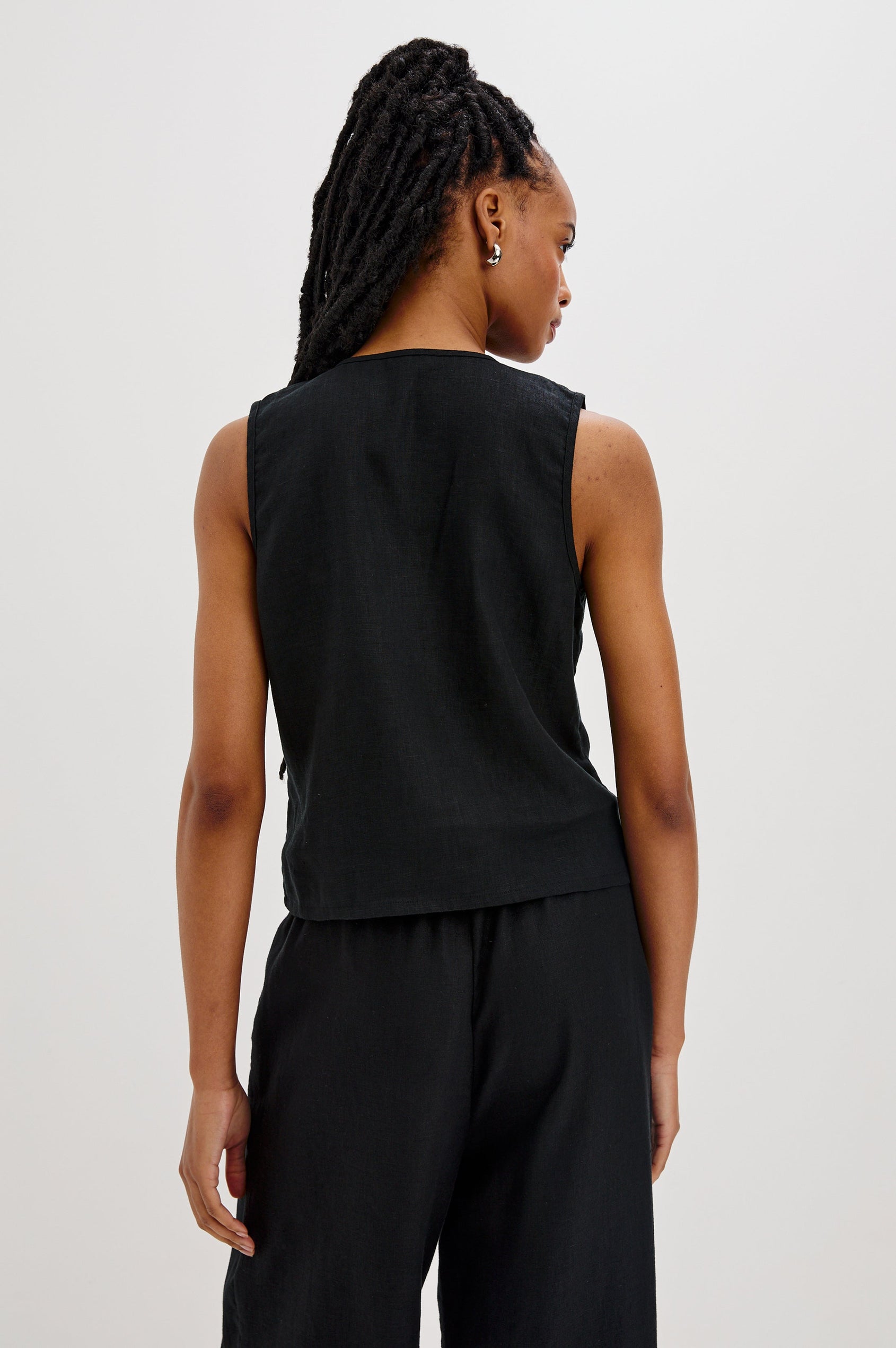Oregon Sleeveless Vest Top with Tie Front in Black Colorway. Back View Shown on Model.
