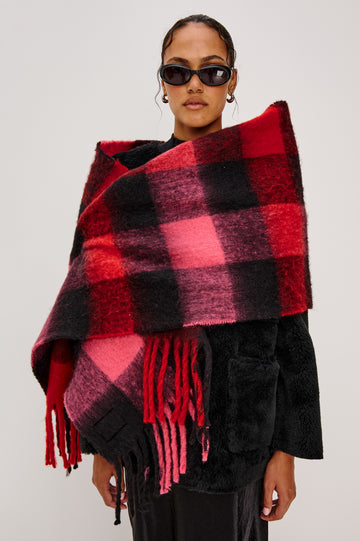 Oslo Scarf with Twisted Tassels and a Checkered Pattern in Charcoal Black Colorway - Front View Featured on Model