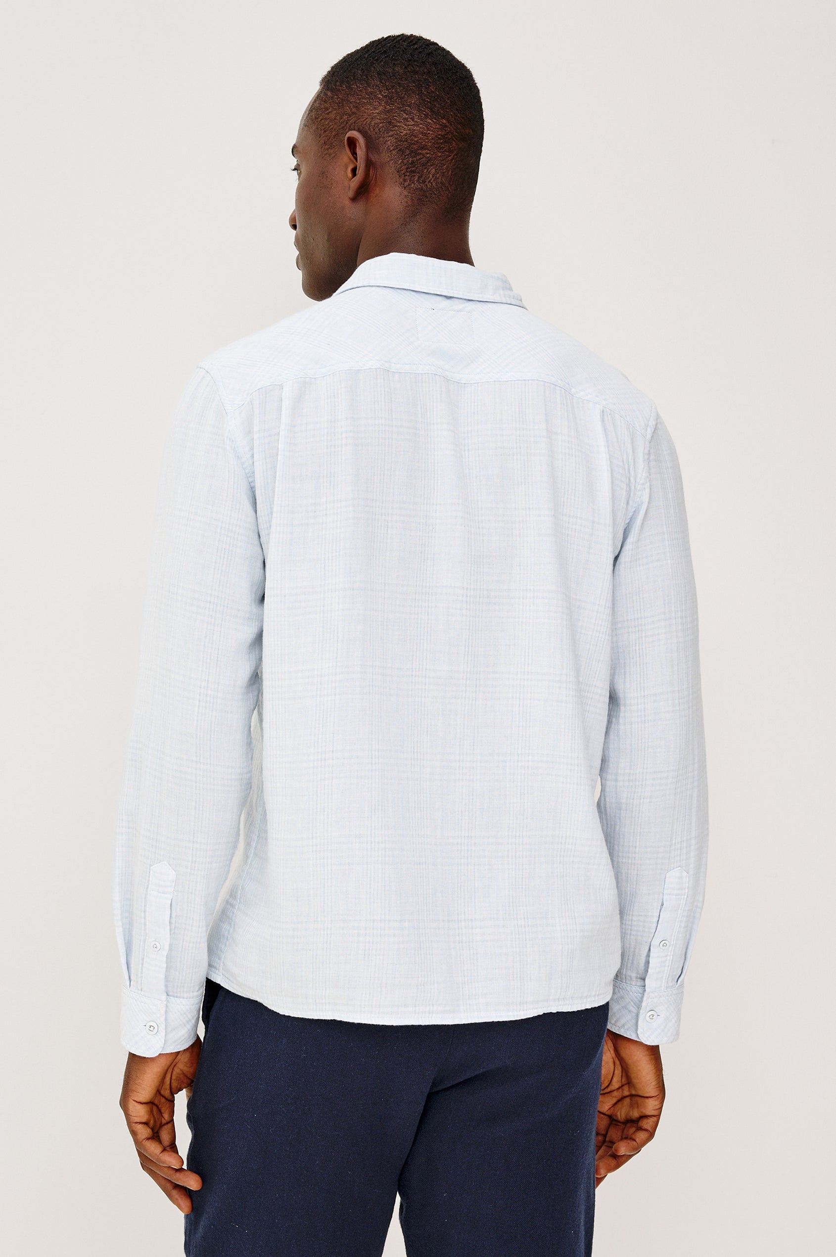 Owens Button-Up Shirt in Lightweight Cotton With Subtle Texture, Collar, Long Sleeves, and Chest Patch Pocket in Coastal Mist Colorway - Upper Body Back View Featured on Model