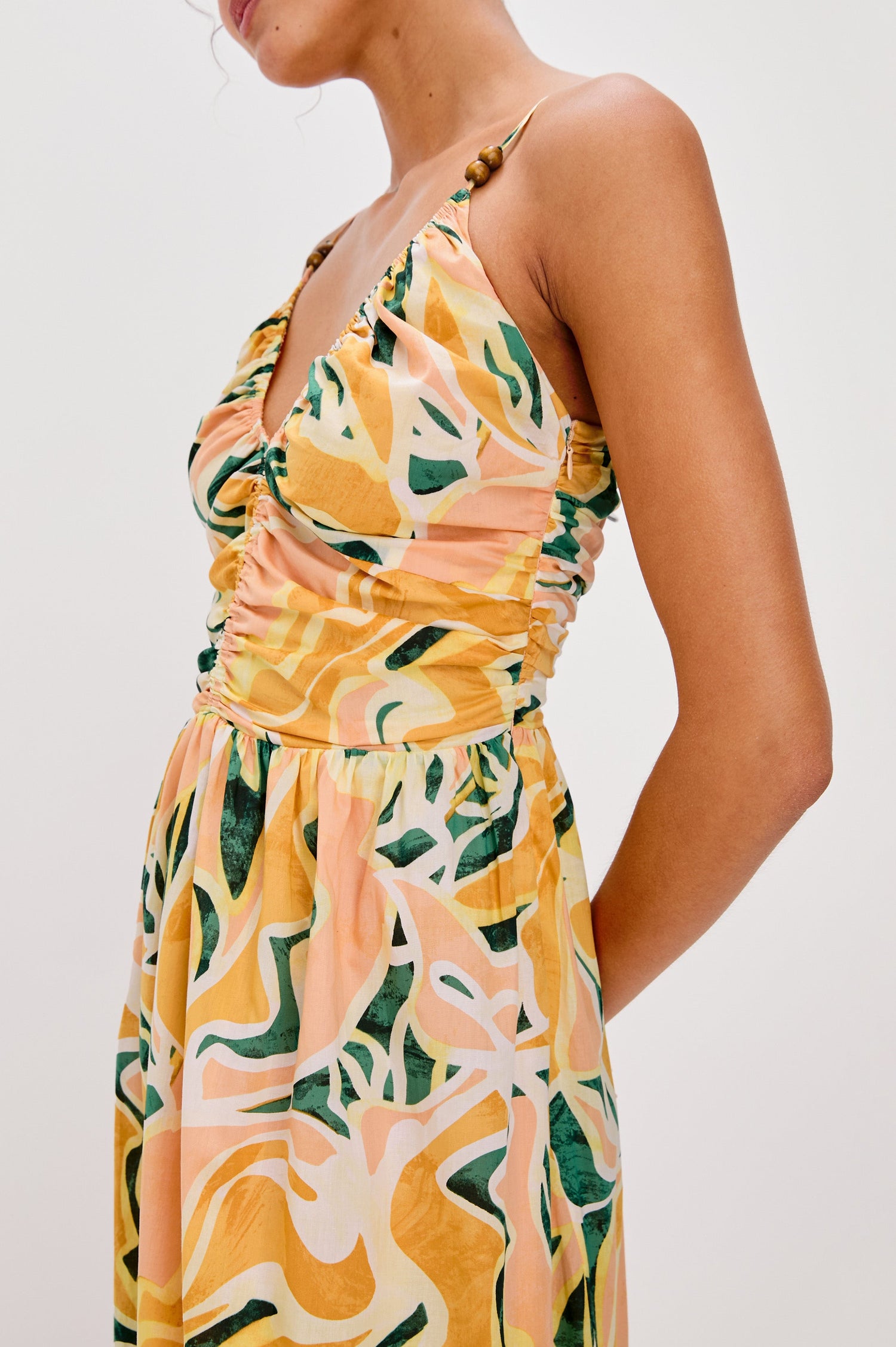 Palm V-Neck Midi Dress with Spaghetti Straps and Gathering Details on Bodice in Tulum Colorway. Side Detailed View Shown on Model.