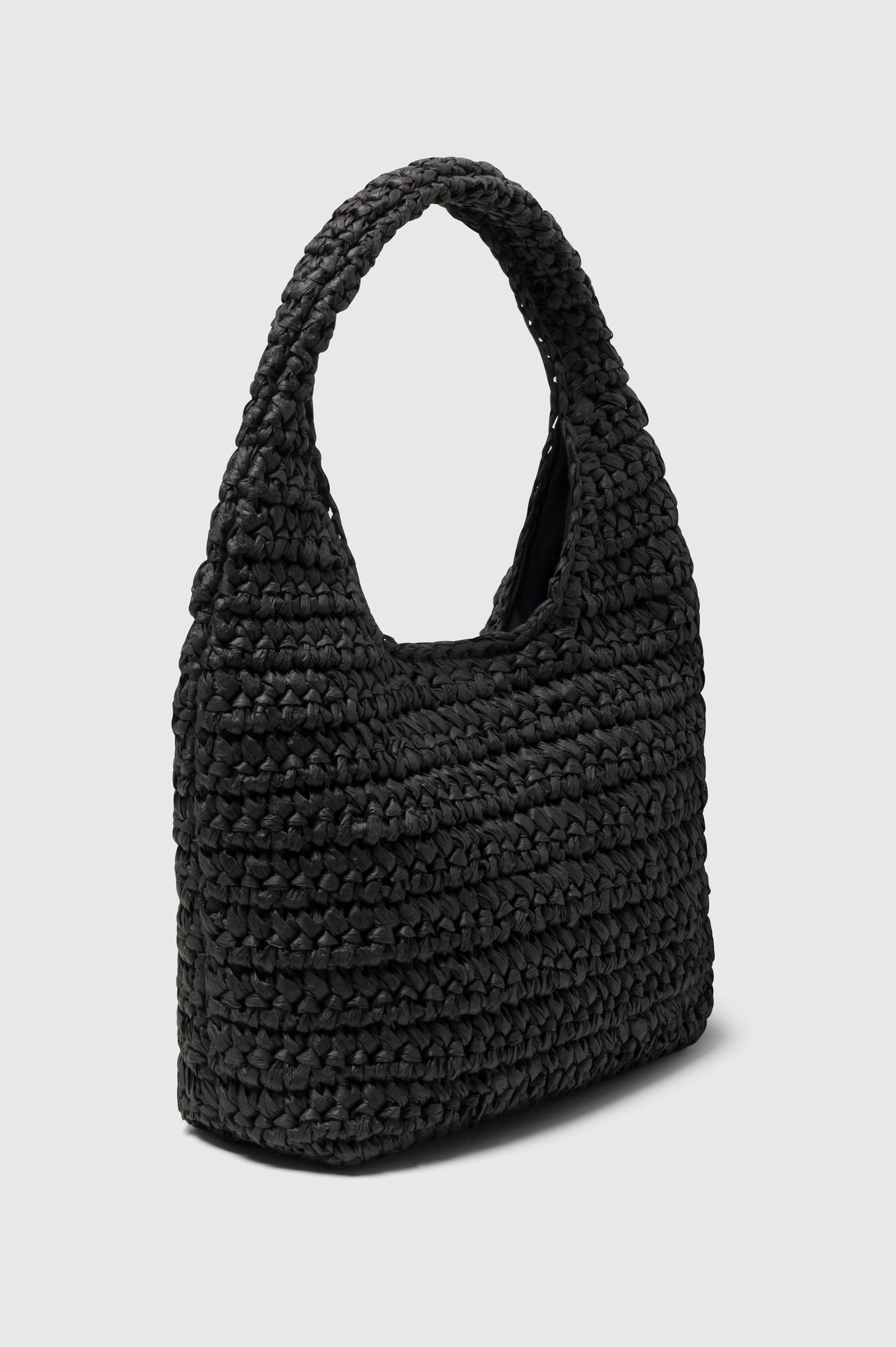 Palma rattan woven shoulder bag in Black - side view