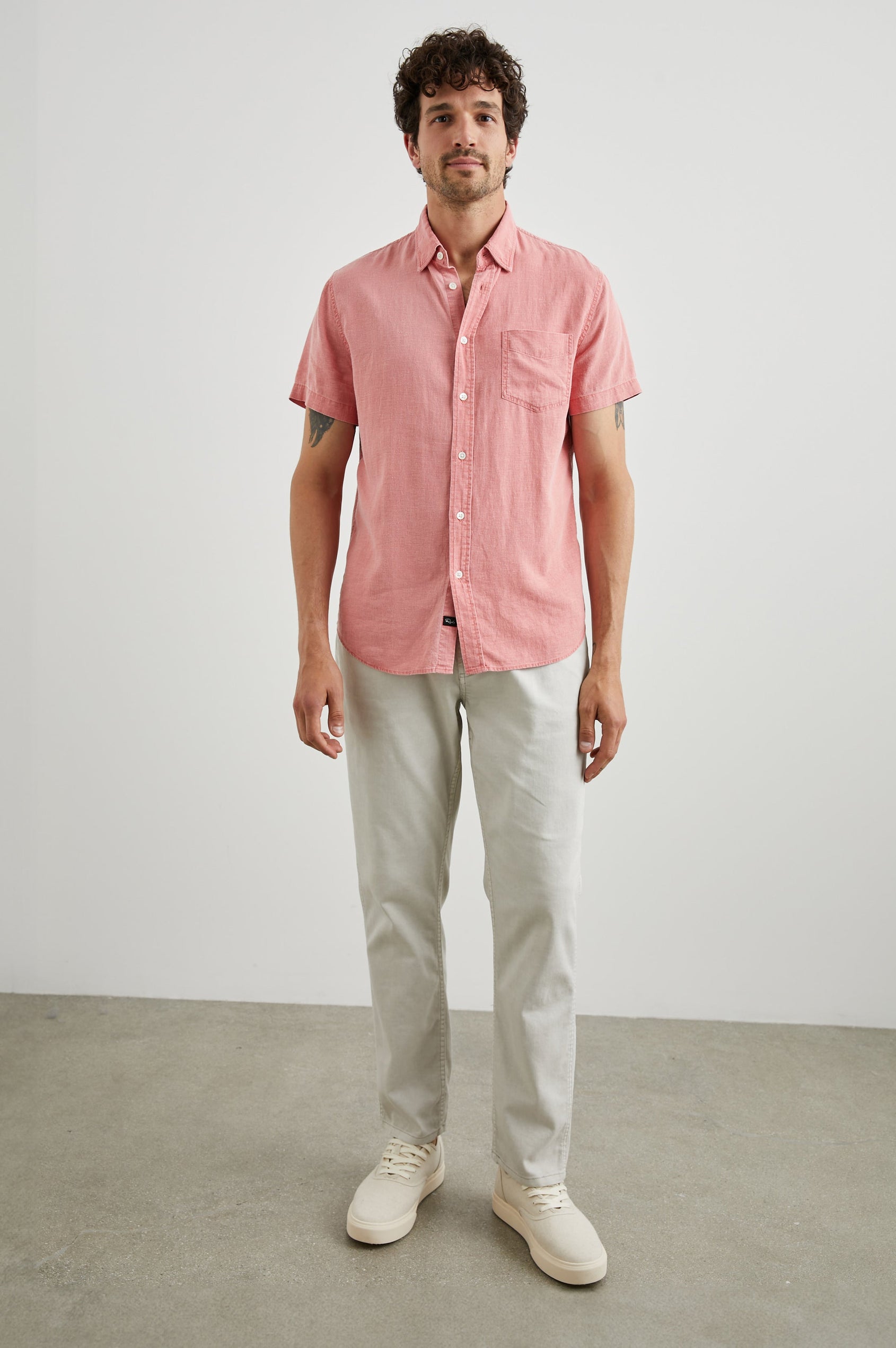 Paros Short-Sleeve Button Up with a Chest Patch Pocket in Equator Colorway, a Pink - Front Full Body View Featured on Model