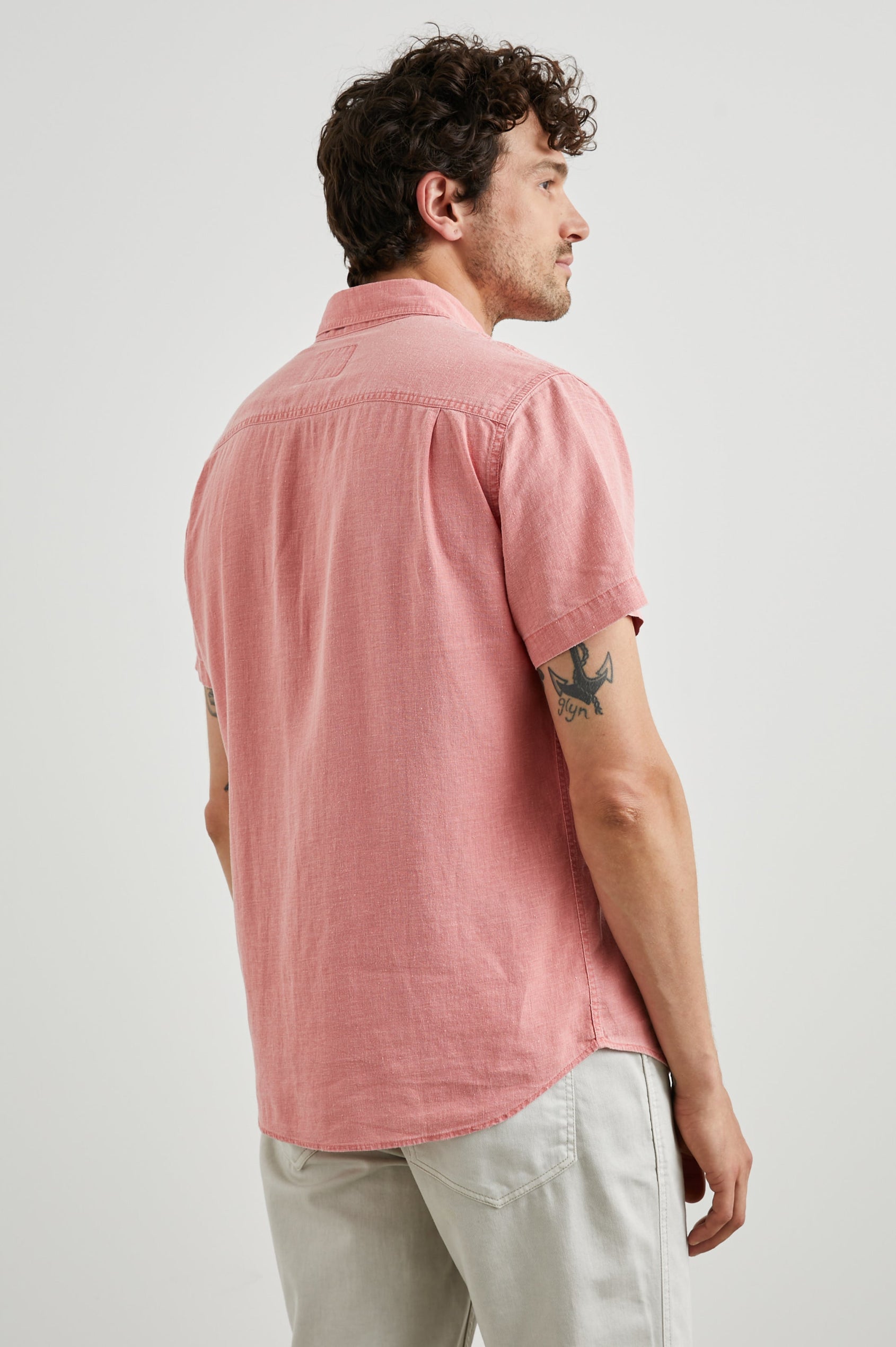 Paros Short-Sleeve Button Up with a Chest Patch Pocket in Equator Colorway, a Pink - Back View Featured on Model