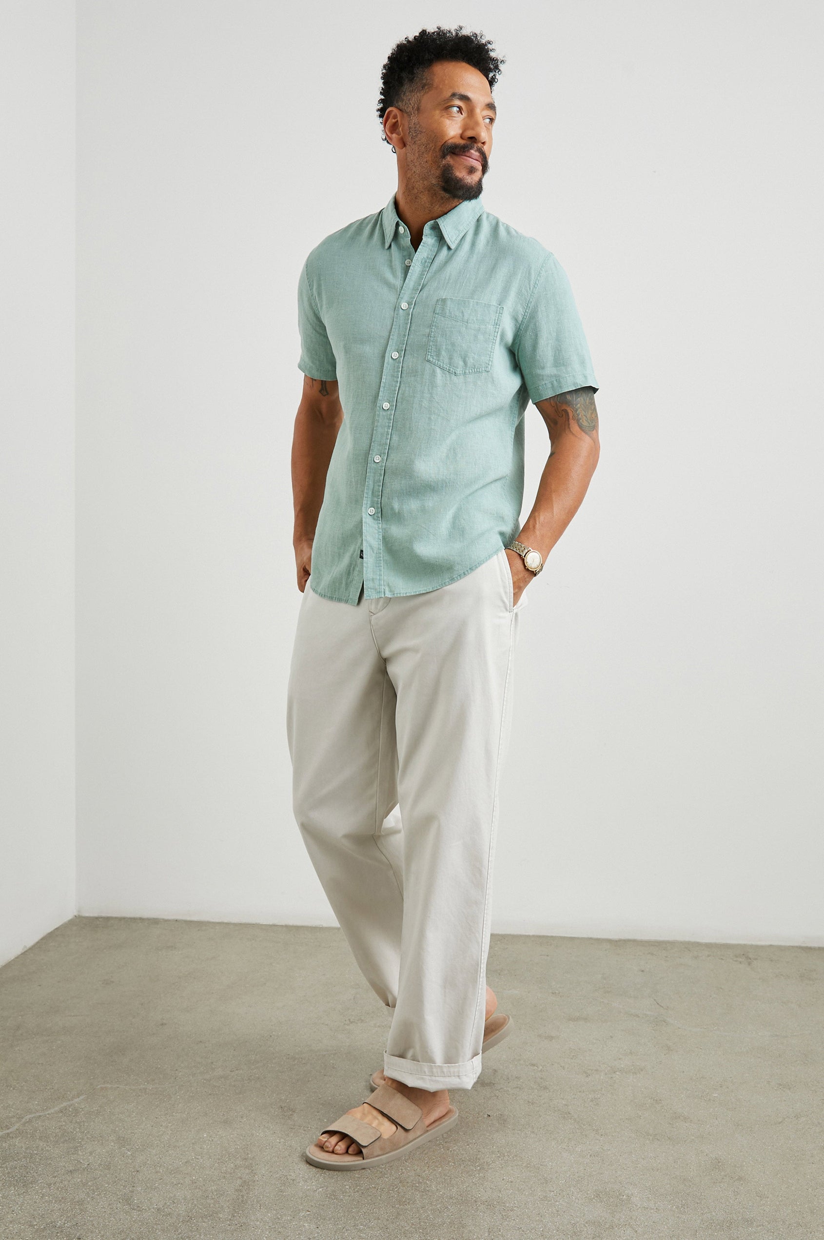 Paros Short-Sleeve Button Up with a Chest Patch Pocket in Jade Colorway - Front Full Body View Featured on Model