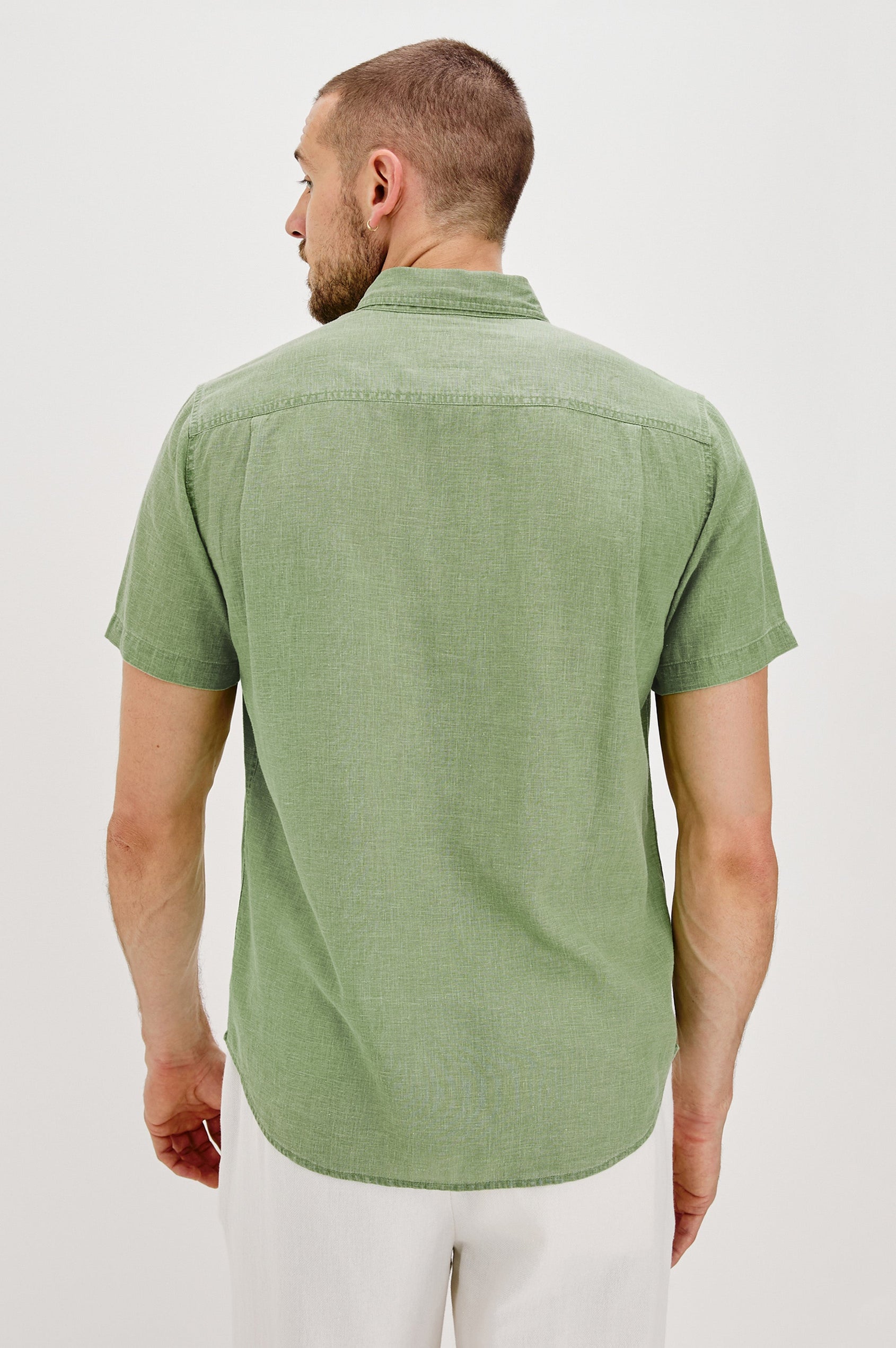 Paros button up short sleeve with front chest pocket and collar in Matcha Colorway- back view on model