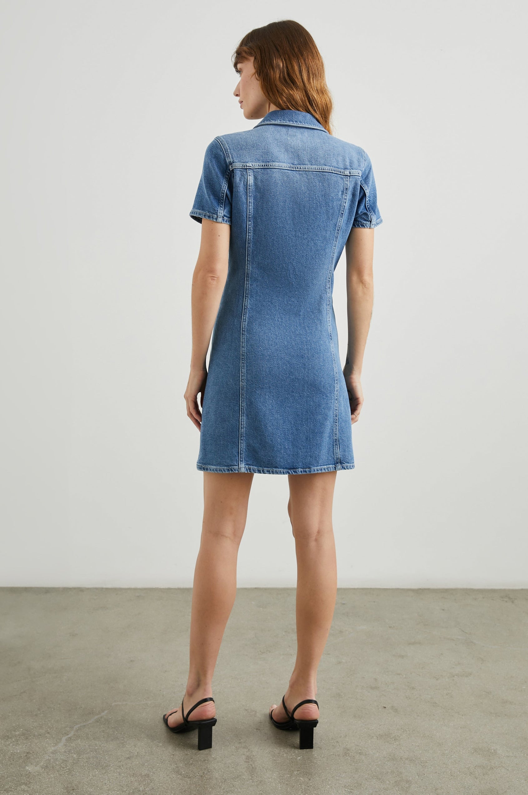 Pasadena Short-Sleeve Denim Mini Dress with a Full Button Front in Cadet Blue Colorway - Back Full Body View Featured on Model 