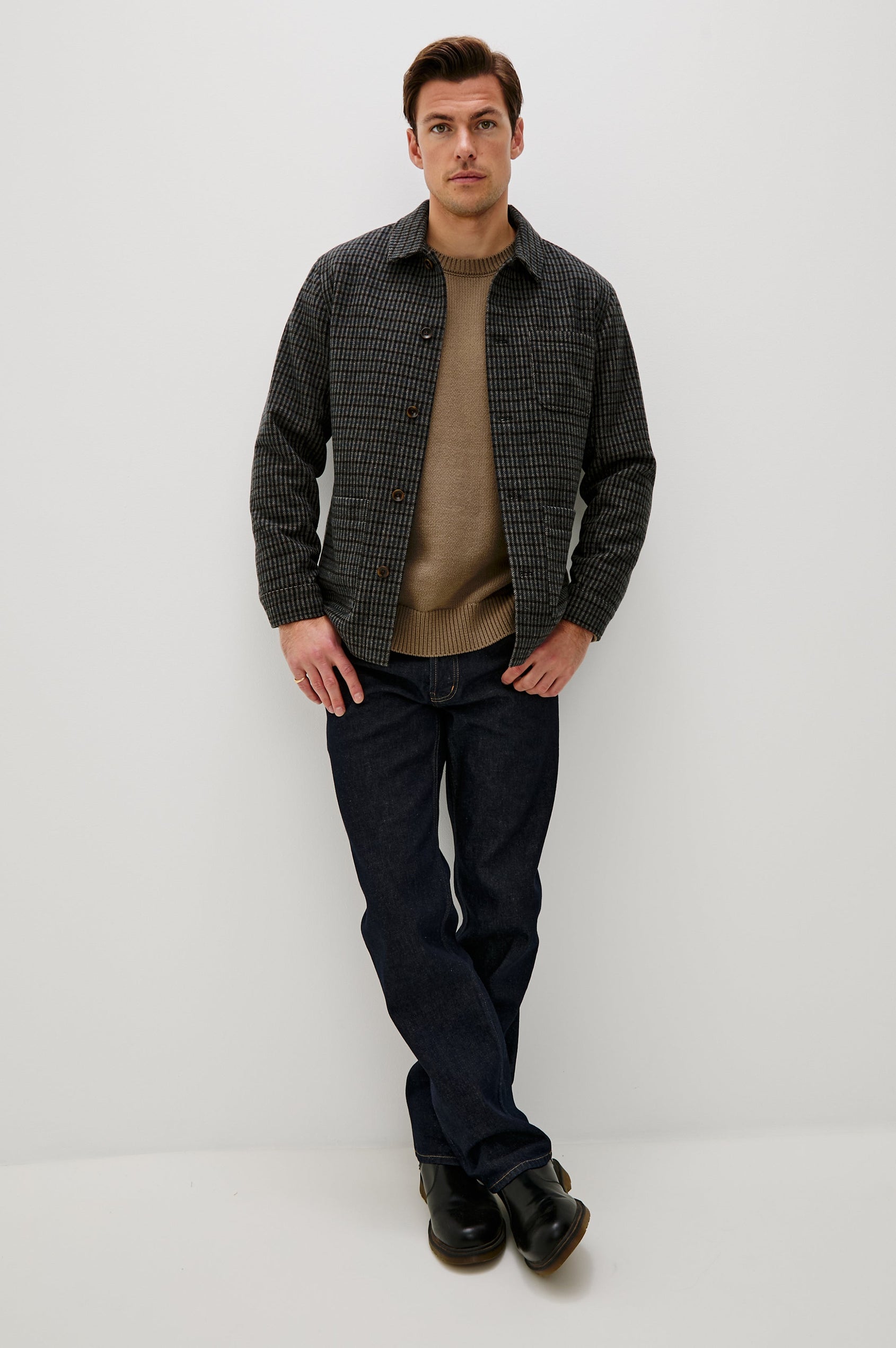 The Pascal is a collared button front jacket with front patch pockets and a chest pocket in Grey Check Plaid colorway. Front full body view featured on model.