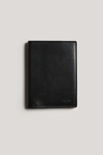 Leather passport holder folded, front view, in Black colorway.