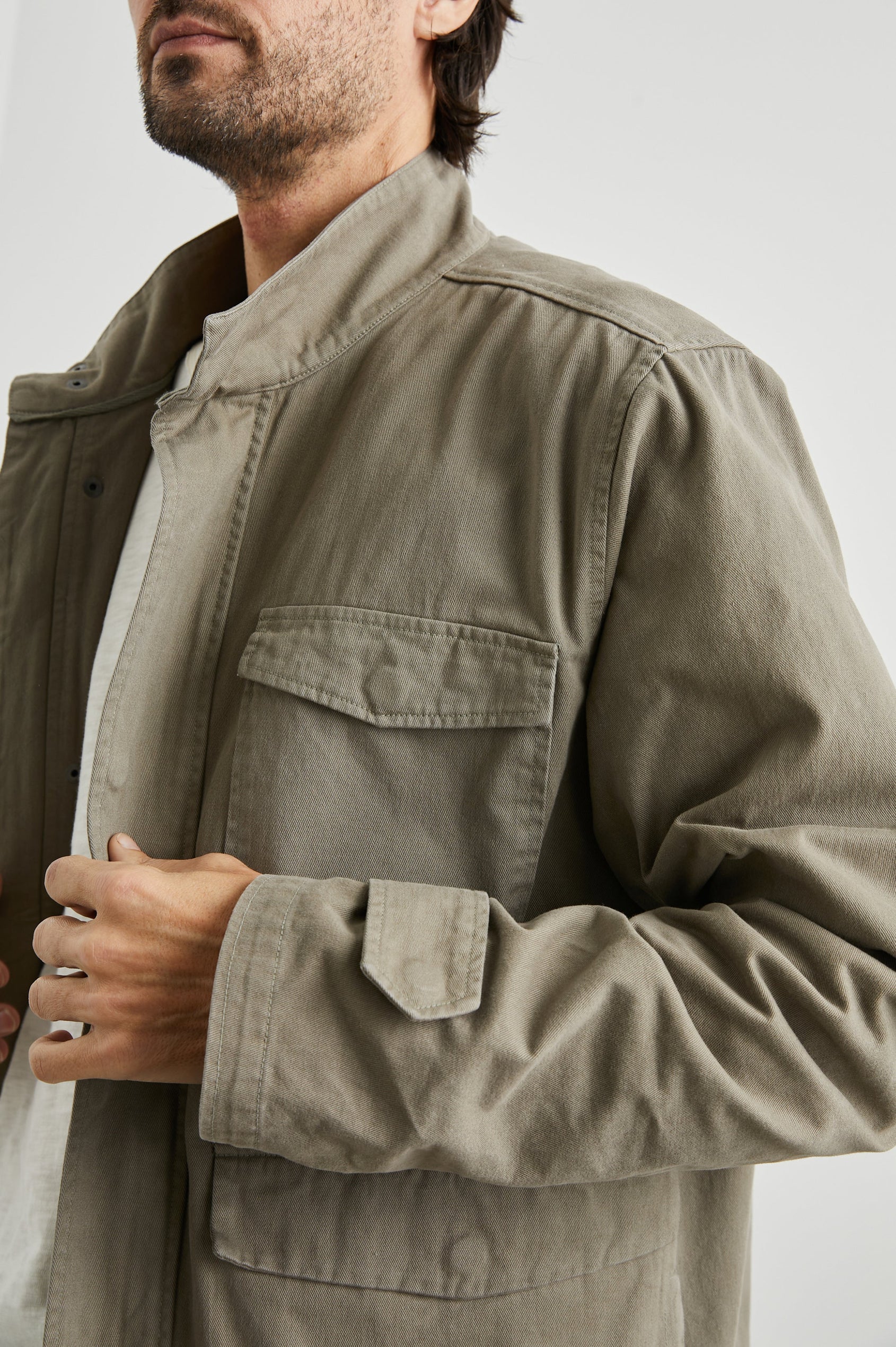 Paulsen Jacket with a Snap and Zip Closure, Two Front Snap Flap Pockets, Two Chest Snap Flap Pockets and a Snap Turnback in Sage Colorway - Front View Featured on Model 