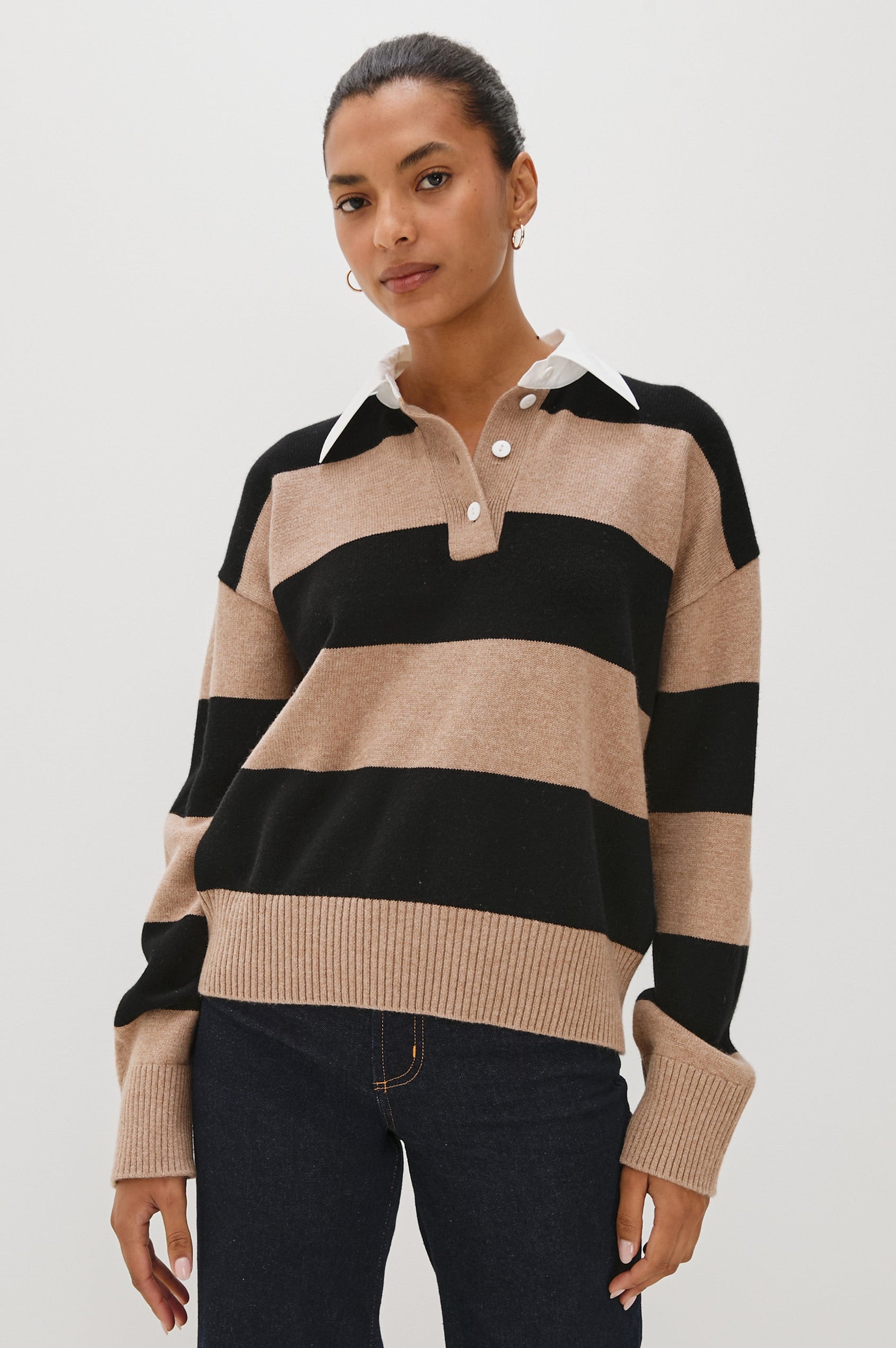 Cotton-cashmere henley sweater with relaxed fit. Design features black heritage-style stripes and a contrasting white cotton poplin collar. Front view on model.