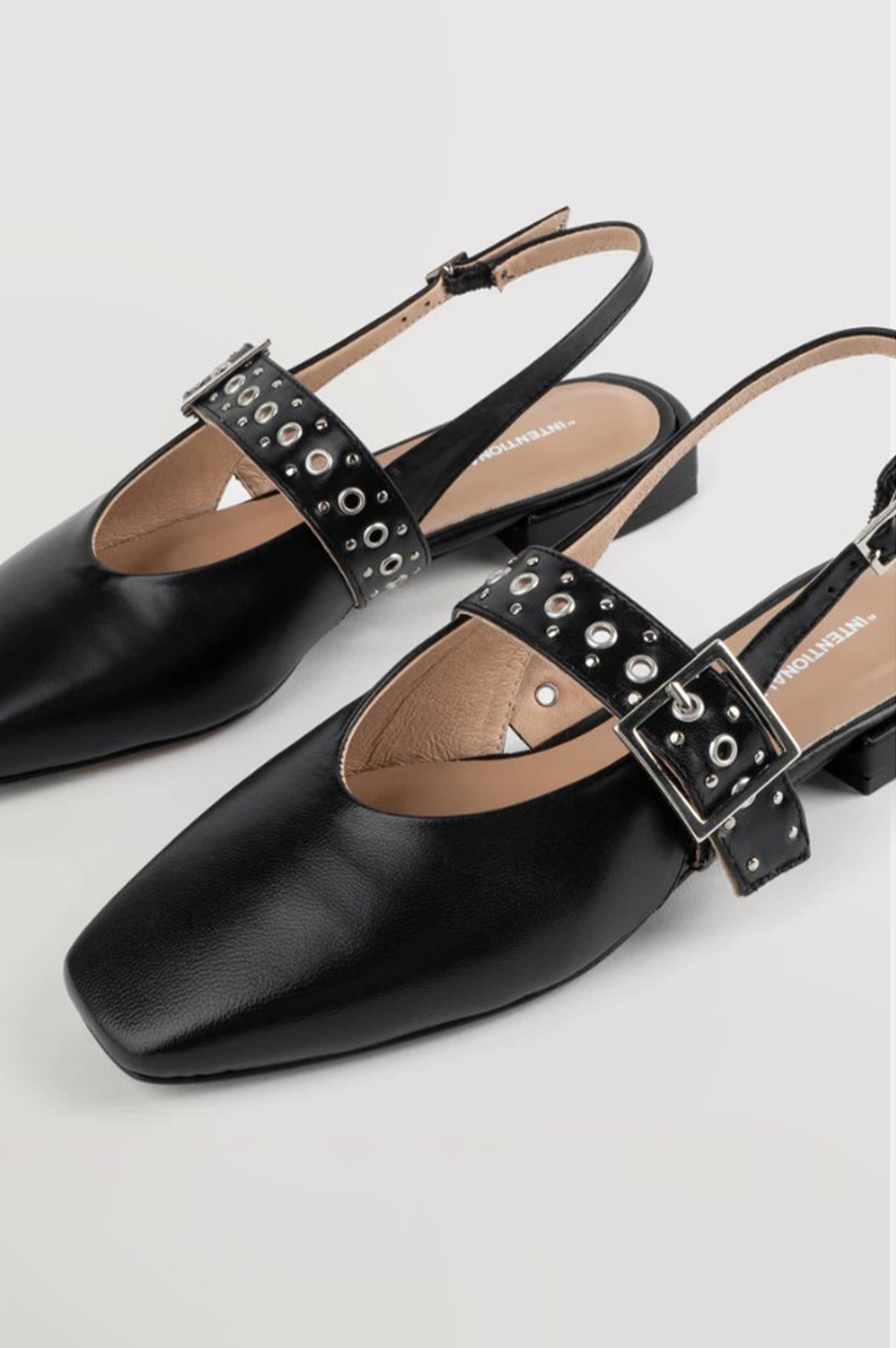Intentionally Blank Pearl Ballet Flat with an Adjustable Slingback Strap, a Studded Upper Buckle Strap, a Small Heel and a Square Toe in Black Colorway - Overhead View 