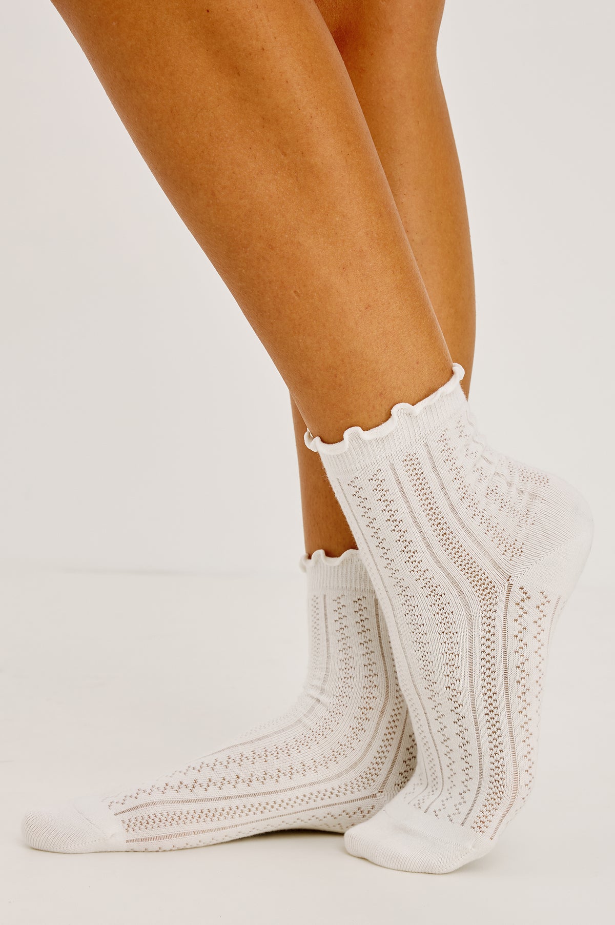 Pointelle Crew Socks in Soft Cotton Blend With Ruffle Trim in Ivory Colorway - Upper Body Front View Featured on Model.