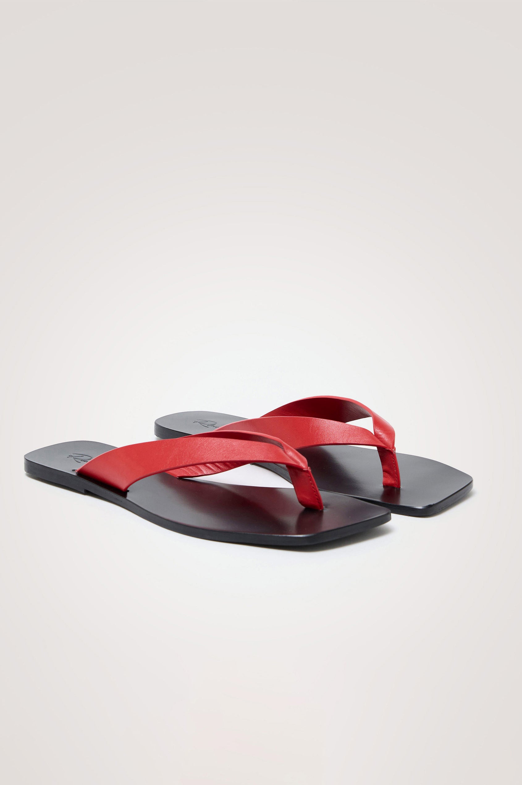 Porto Thong Sandal in Leather With Square Toe and Contrast Cushioned Footbed With Branded Embossed Detail in Tomato Colorway - Side View Featured