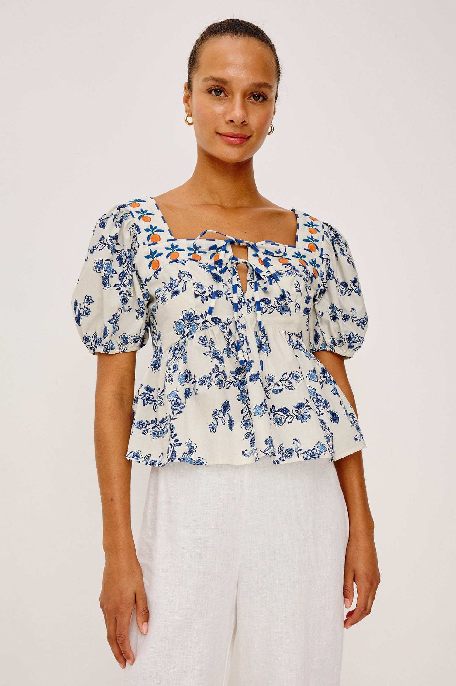 Presley Top in Cotton Poplin With Square Neckline, Short Puff Sleeves, Embroidered Oranges, and Darts for Shaping in Ceramic Floral Colorway - Upper Body Front View Featured on Model
