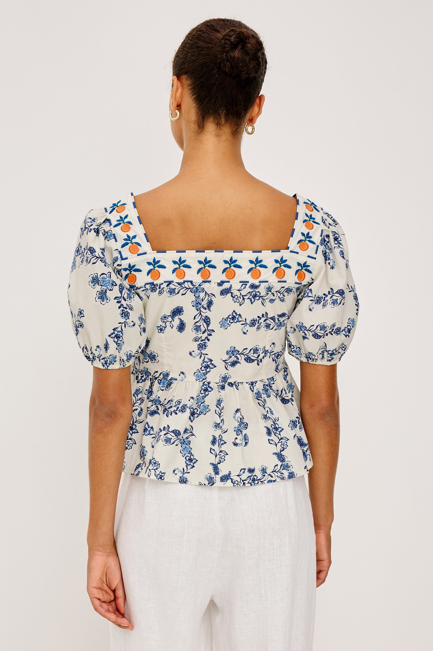 Presley Top in Cotton Poplin With Square Neckline, Short Puff Sleeves, Embroidered Oranges, and Darts for Shaping in Ceramic Floral Colorway - Upper Body Back View Featured on Model