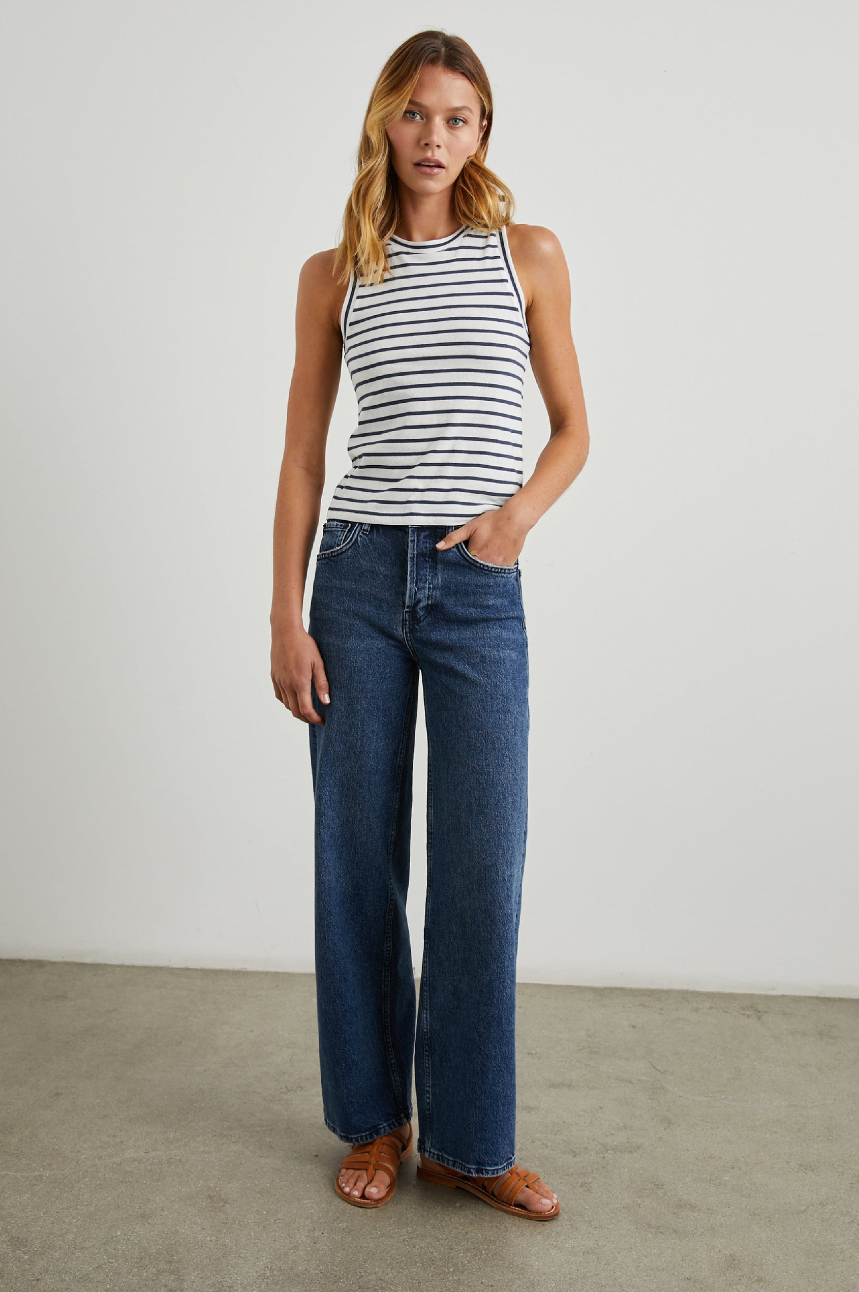 The Racer Ribbed Tank with a Crew Neckline in Sailor Stripe Navy Colorway, with navy and white horizontal stripes - Front Full Body View Featured on Model