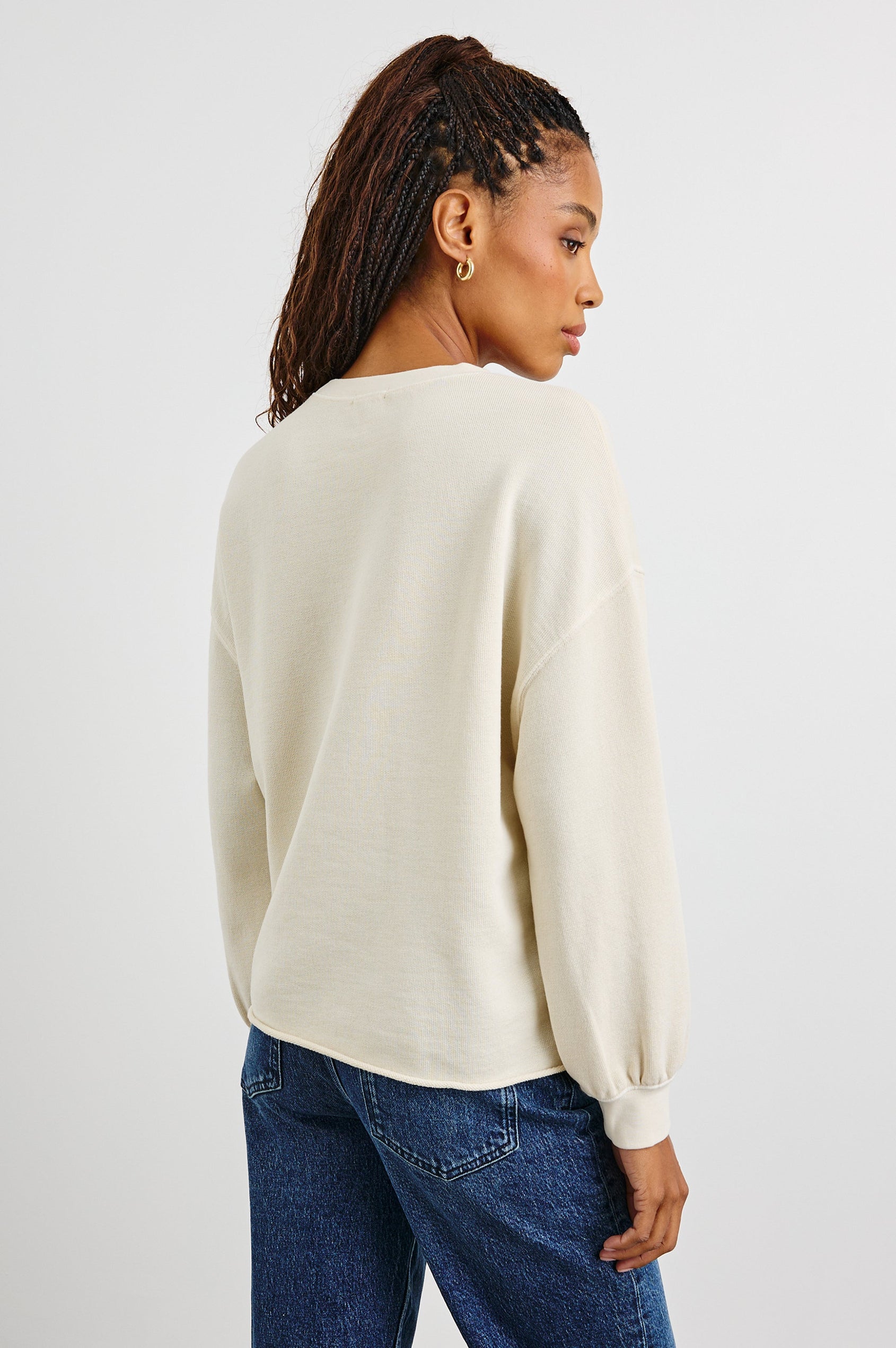 Rails Signature Long-Sleeve Sweatshirt with a Crew Neck, Raw Hem, Shirring Above Cuff, and the Text, Rails, in Ivory Colorway, with Multi Colored Text - Back View Featured on Model 