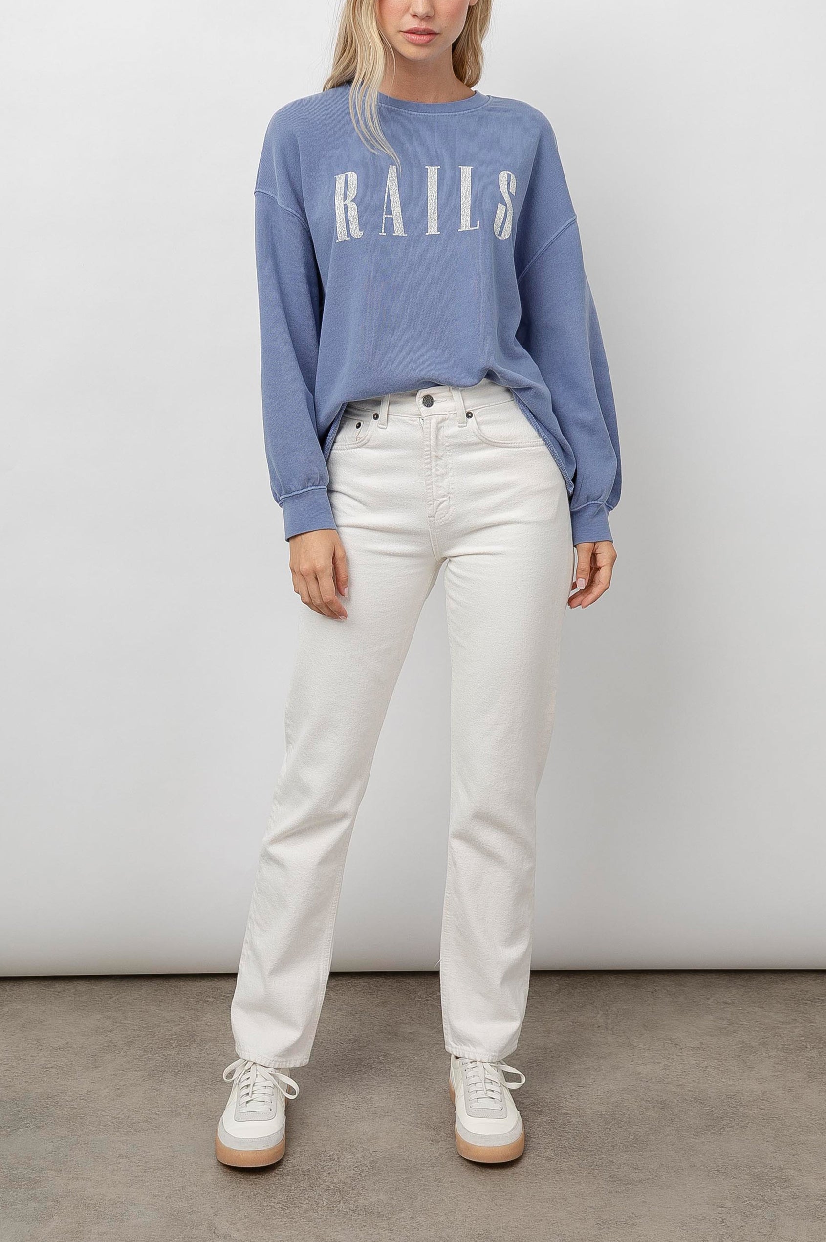Rails Signature Long-Sleeve Sweatshirt with a Crew Neck, Raw Hem, Shirring Above Cuff, and the Text, Rails, in Washed Indigo Rails Colorway, with Ivory Text - Front Full Body View Featured on Model 