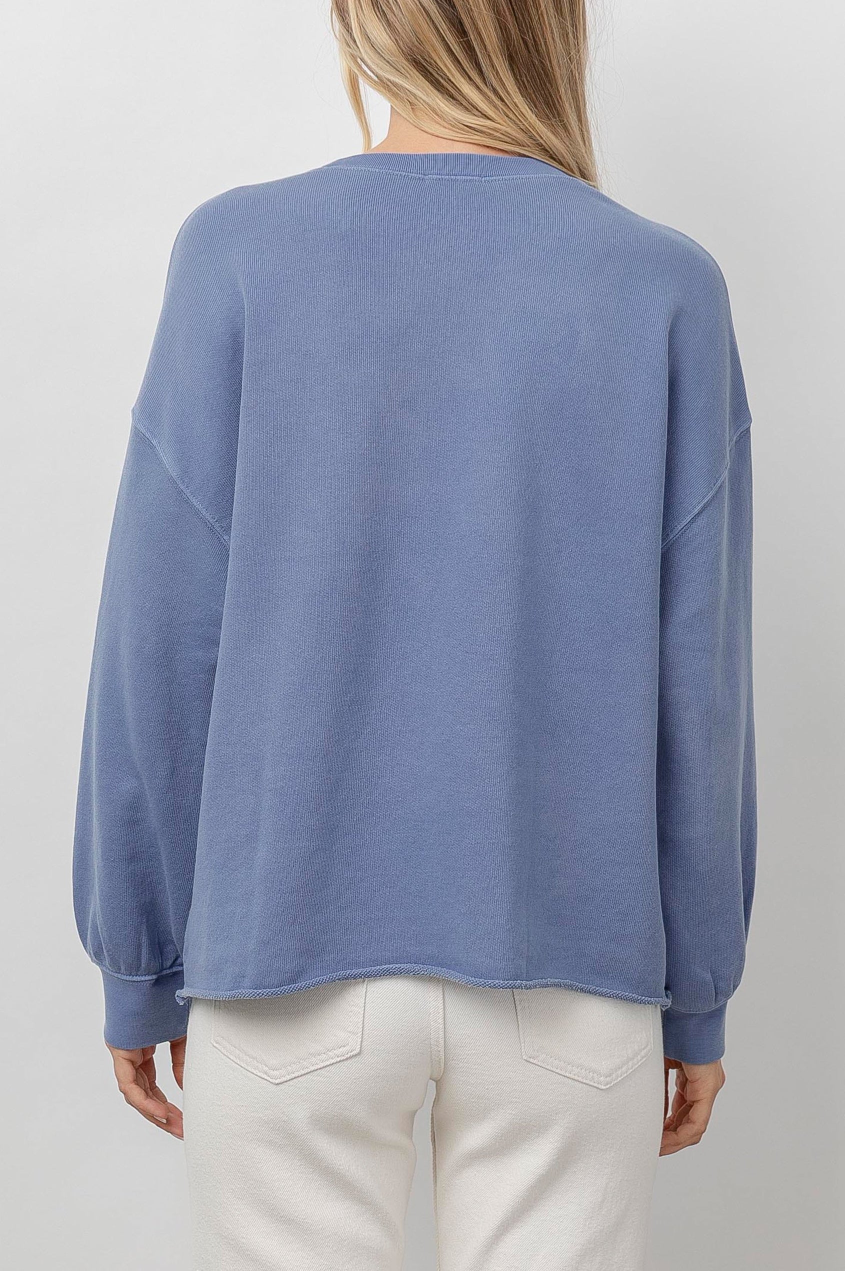 Rails Signature Long-Sleeve Sweatshirt with a Crew Neck, Raw Hem, Shirring Above Cuff, and the Text, Rails, in Washed Indigo Rails Colorway, with Ivory Text - Back View Featured on Model 