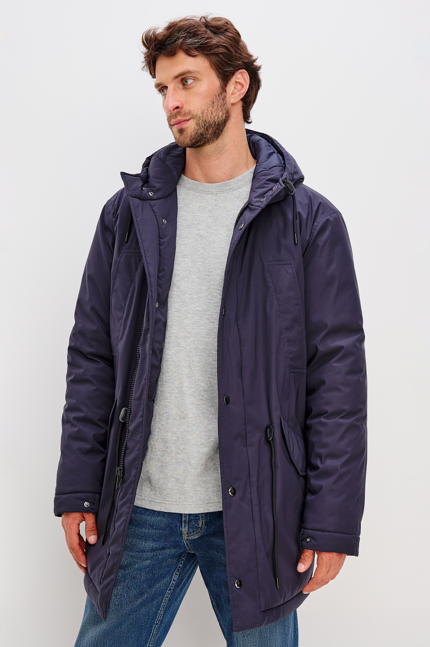 Rainier Parka Coat With Drawcord Hood in Water-Resistant Nylon, Side Snap Button Pockets, Double Front Snap Flap, and Back Seam Vent in Navy Colorway - Full Body Front View Featured on Model