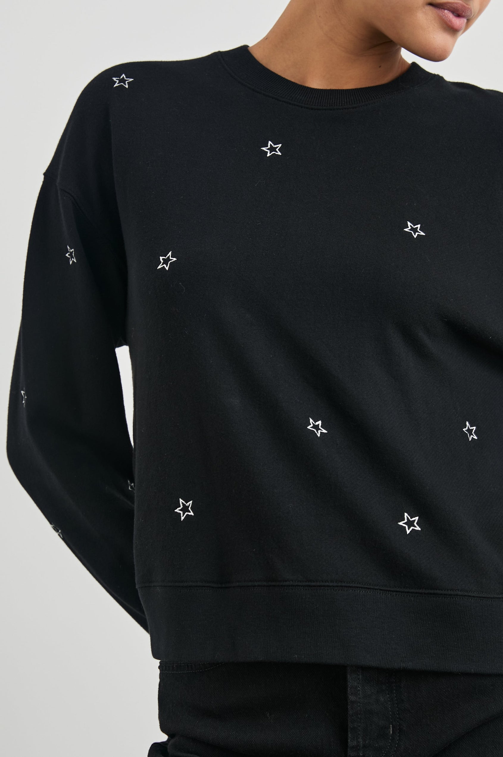Ramona Long-Sleeve Sweatshirt with a Crew Neck in Black Silver Star Embroidery Colorway, Silver Stars on Black - Front View Featured on Model