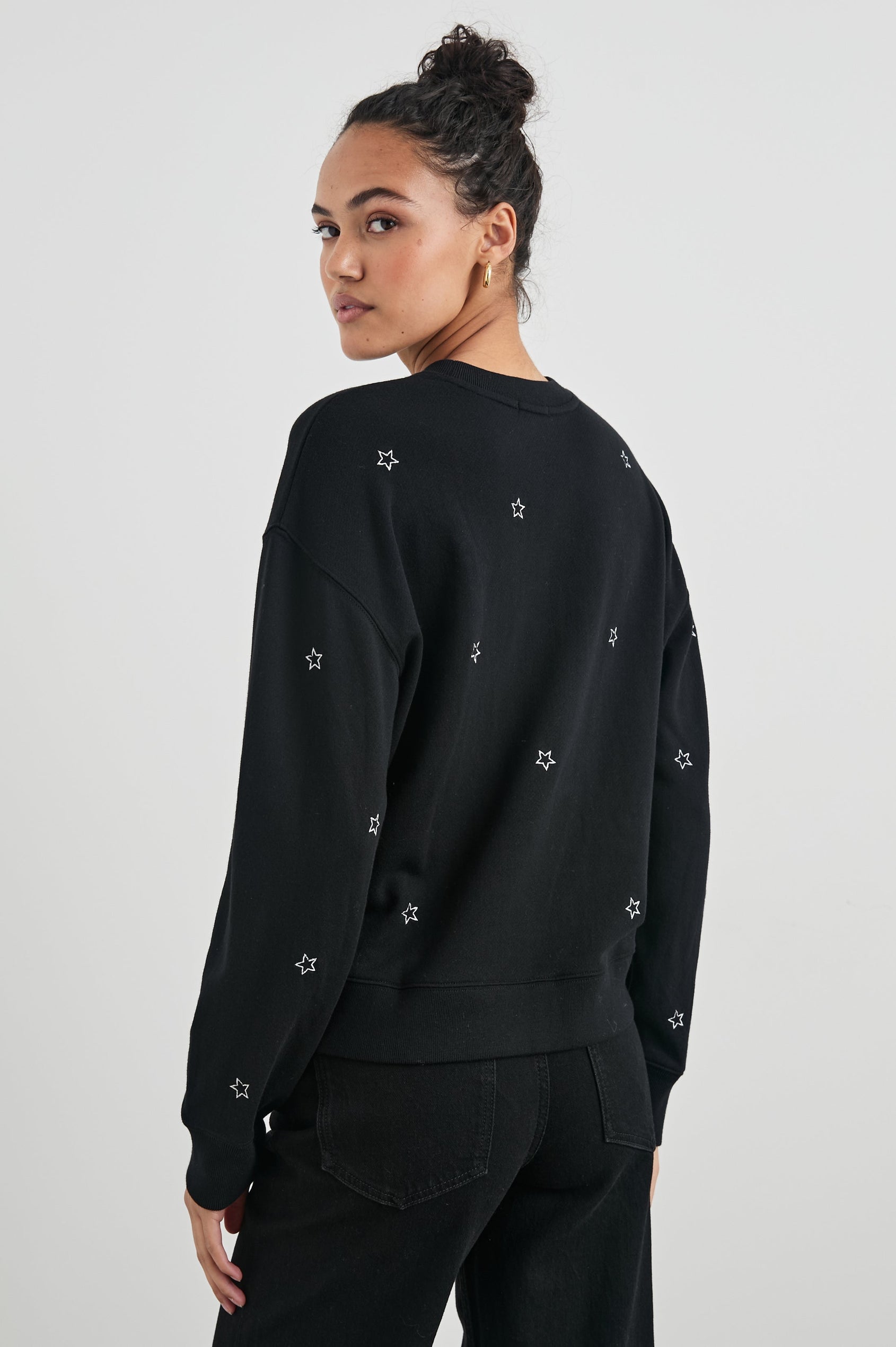 Ramona Long-Sleeve Sweatshirt with a Crew Neck in Black Silver Star Embroidery Colorway, Silver Stars on Black - Back View Featured on Model