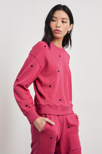 Ramona Long-Sleeve Sweatshirt with a Crew Neck and Embroidered Hearts in Pink Midnight Hearts Colorway, Midnight Hearts on Pink - Front View Featured on Model