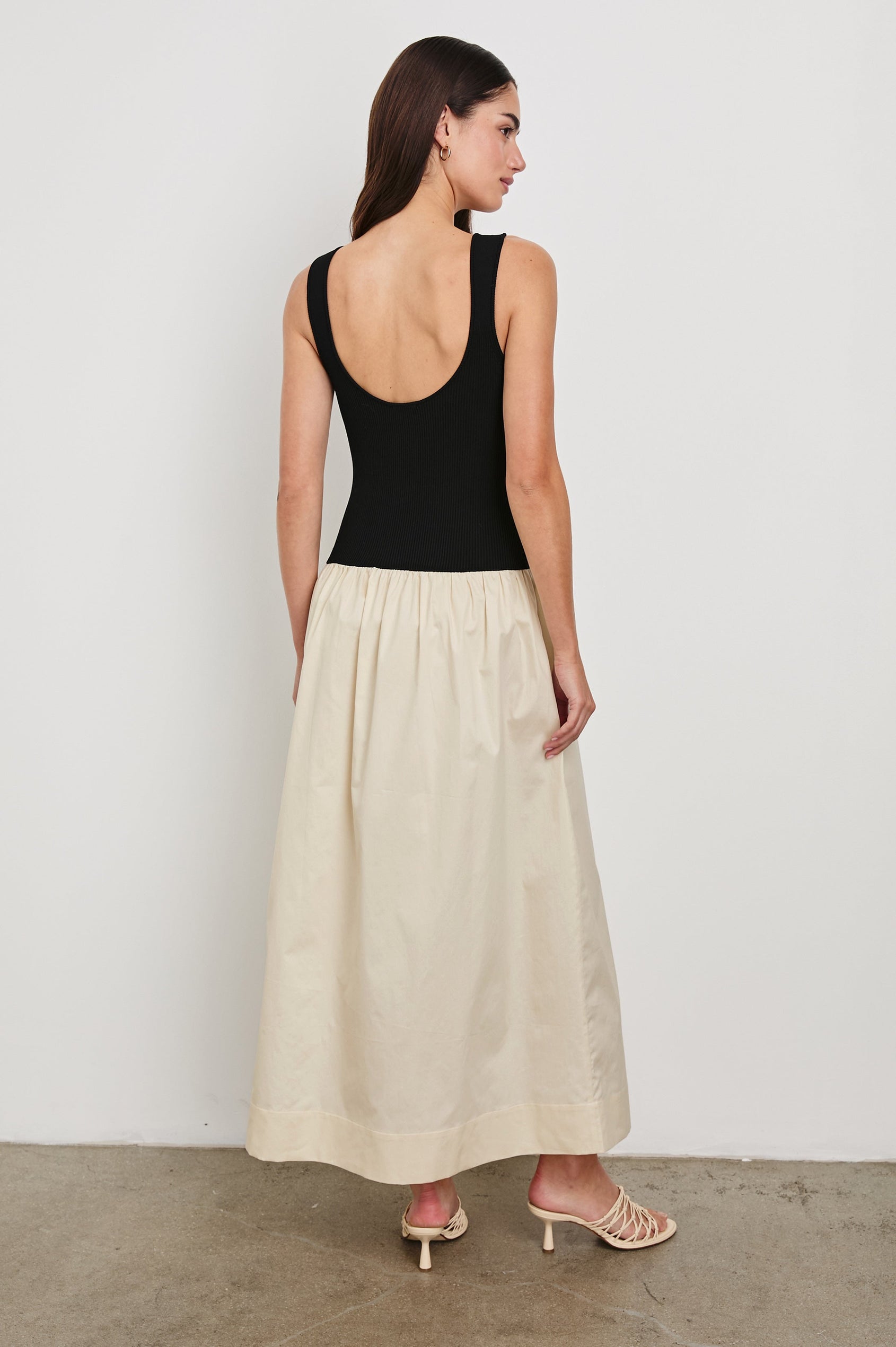Raquel Maxi Dress with Straps, a Scoop Neckline with Keyhole and Pleats at Waistline in Black Ivory Colorway - back view on model