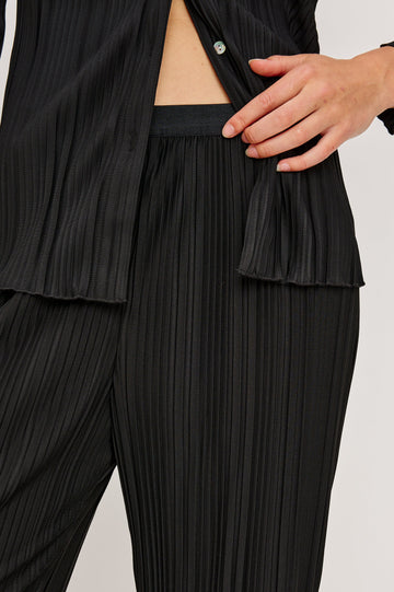 Liana Micro-Pleated Pants with an Elastic Waist in Jet Colorway - Front View Featured on Model 