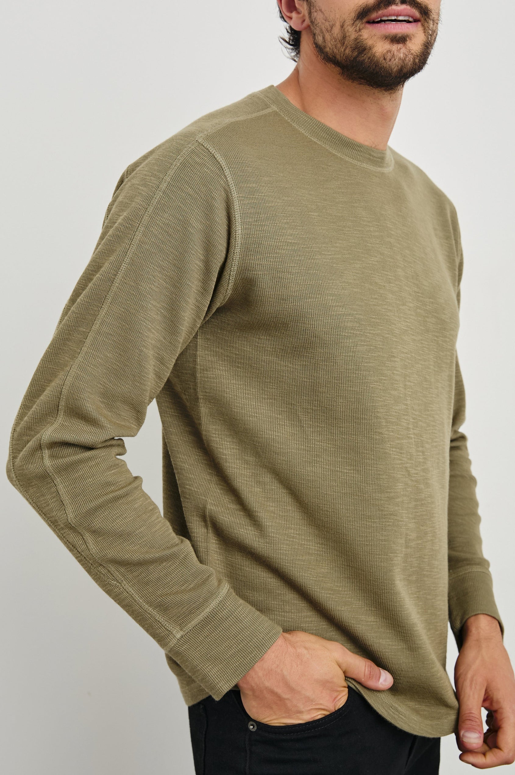 Rheese Long-Sleeve Thermal with Crew Neck and Statement Seams on Sleeves and Back in Green Olive Colorway - Front View Featured on Model