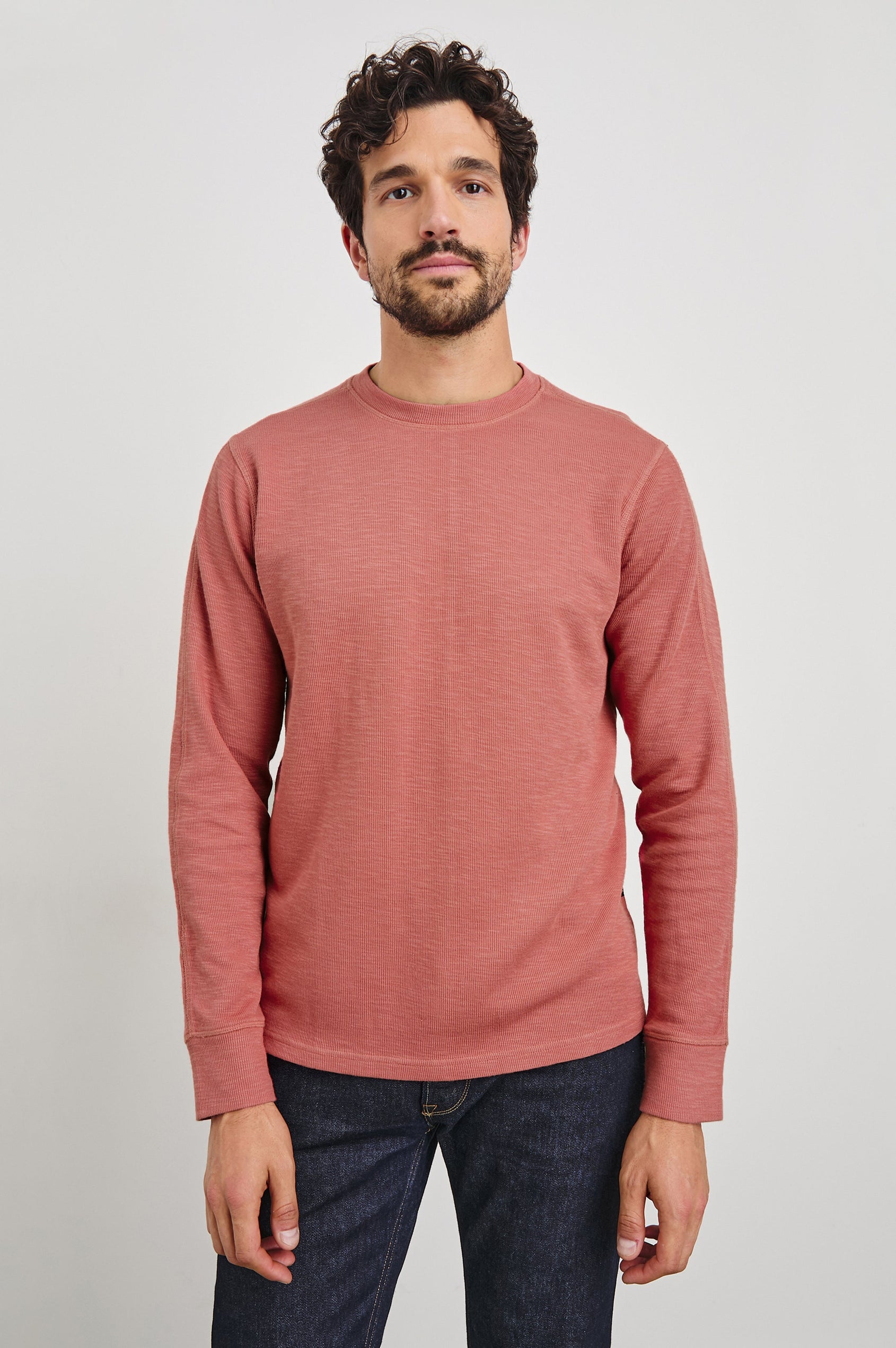 Rheese Long-Sleeve Thermal with Crew Neck and Statement Seams on Sleeves and Back in Red Brick Colorway - Front View Featured on Model