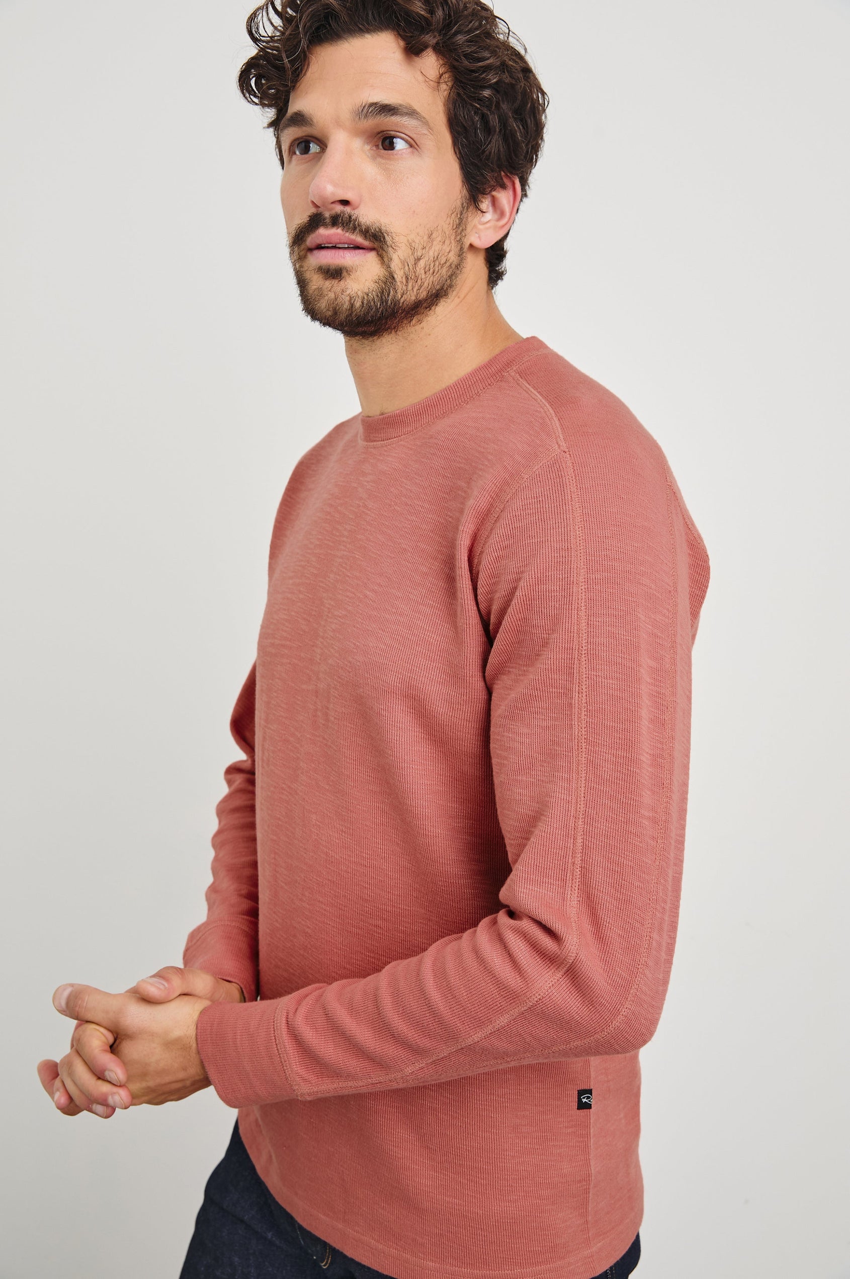 Rheese Long-Sleeve Thermal with Crew Neck and Statement Seams on Sleeves and Back in Red Brick Colorway - Front View Featured on Model