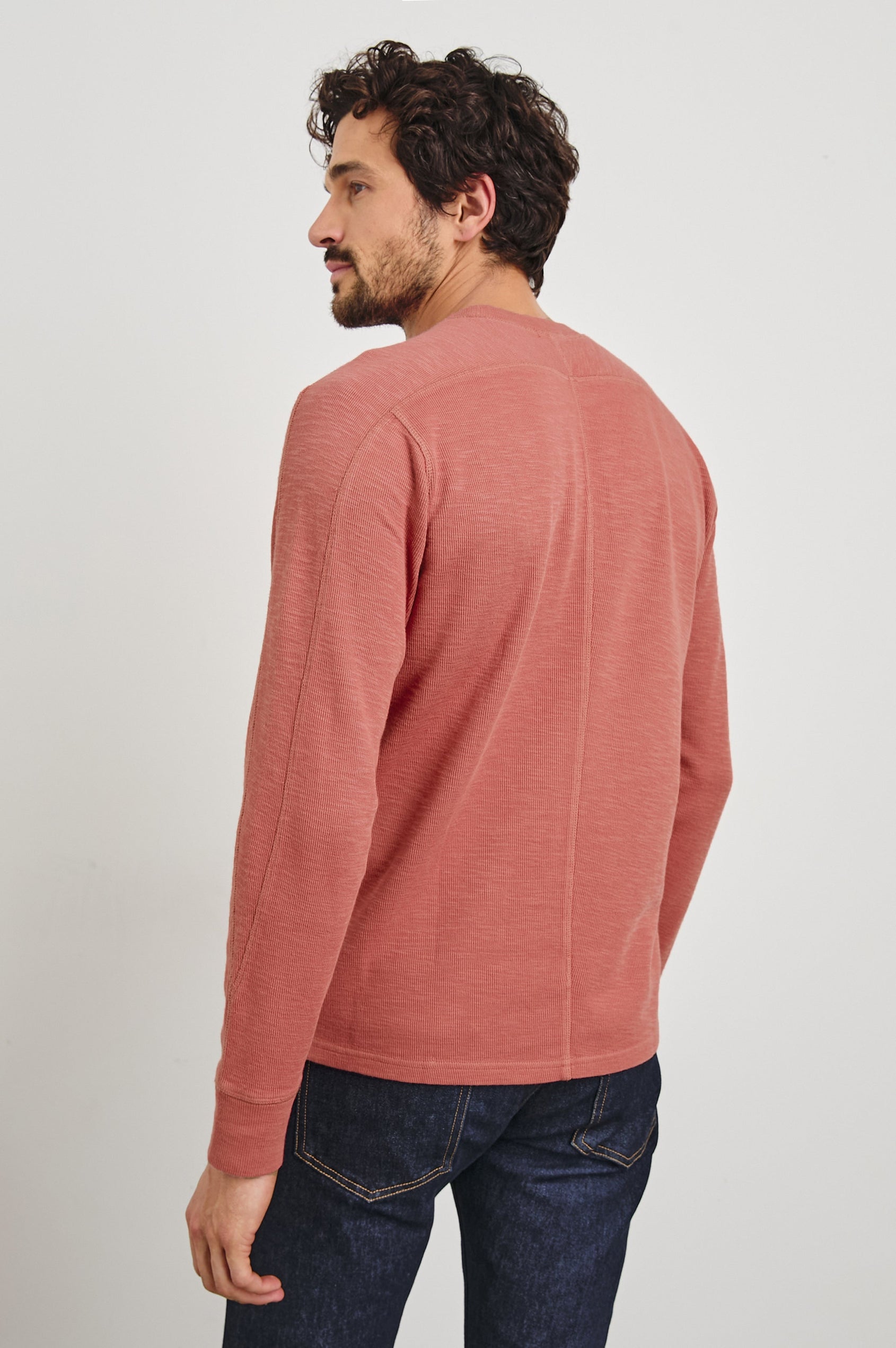 Rheese Long-Sleeve Thermal with Crew Neck and Statement Seams on Sleeves and Back in Red Brick Colorway - Back View Featured on Model