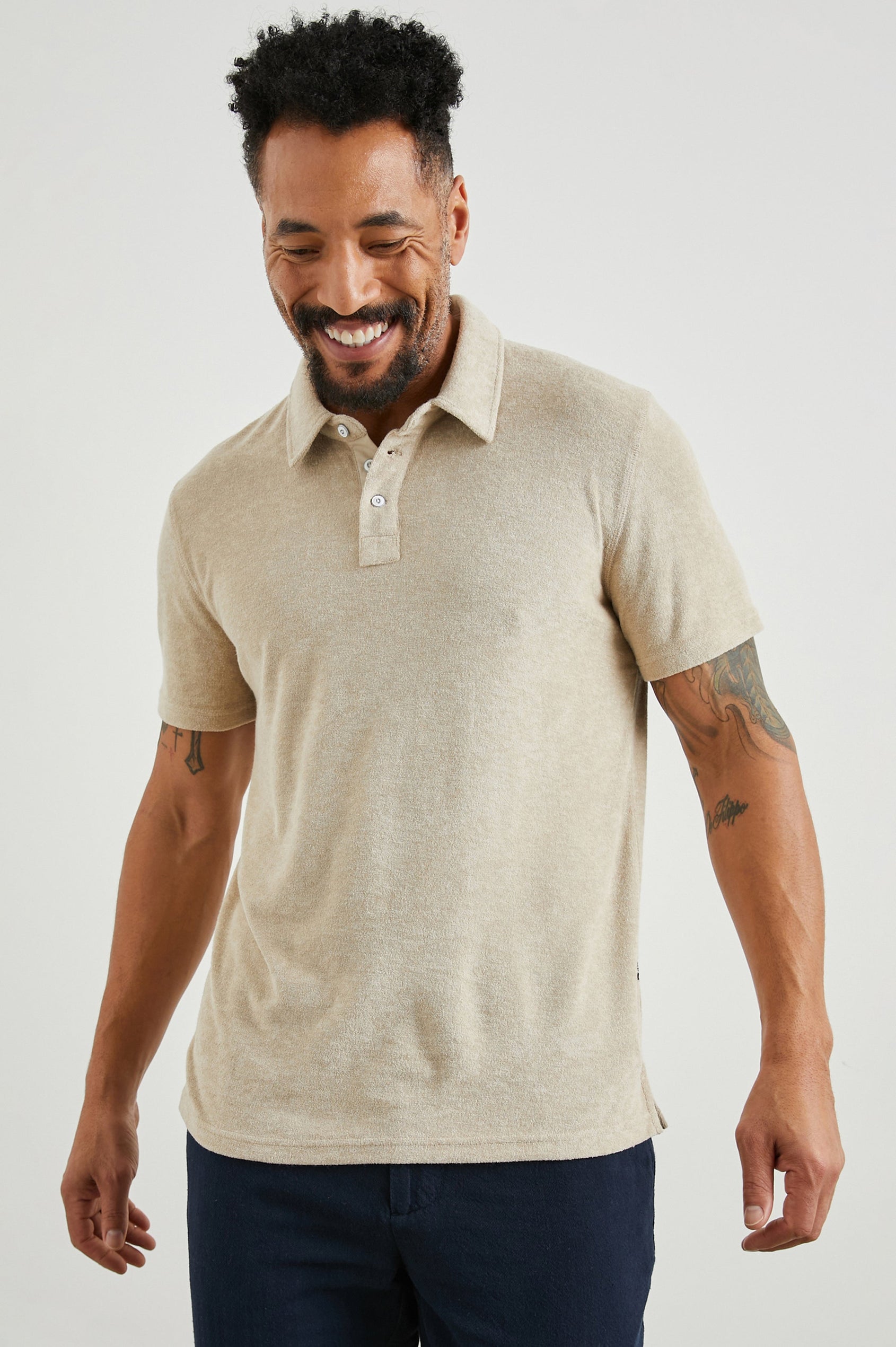 Rhen Short-Sleeve Polo Shirt with a Three-Button Placket in Chickpea Colorway - Front View Featured on Model