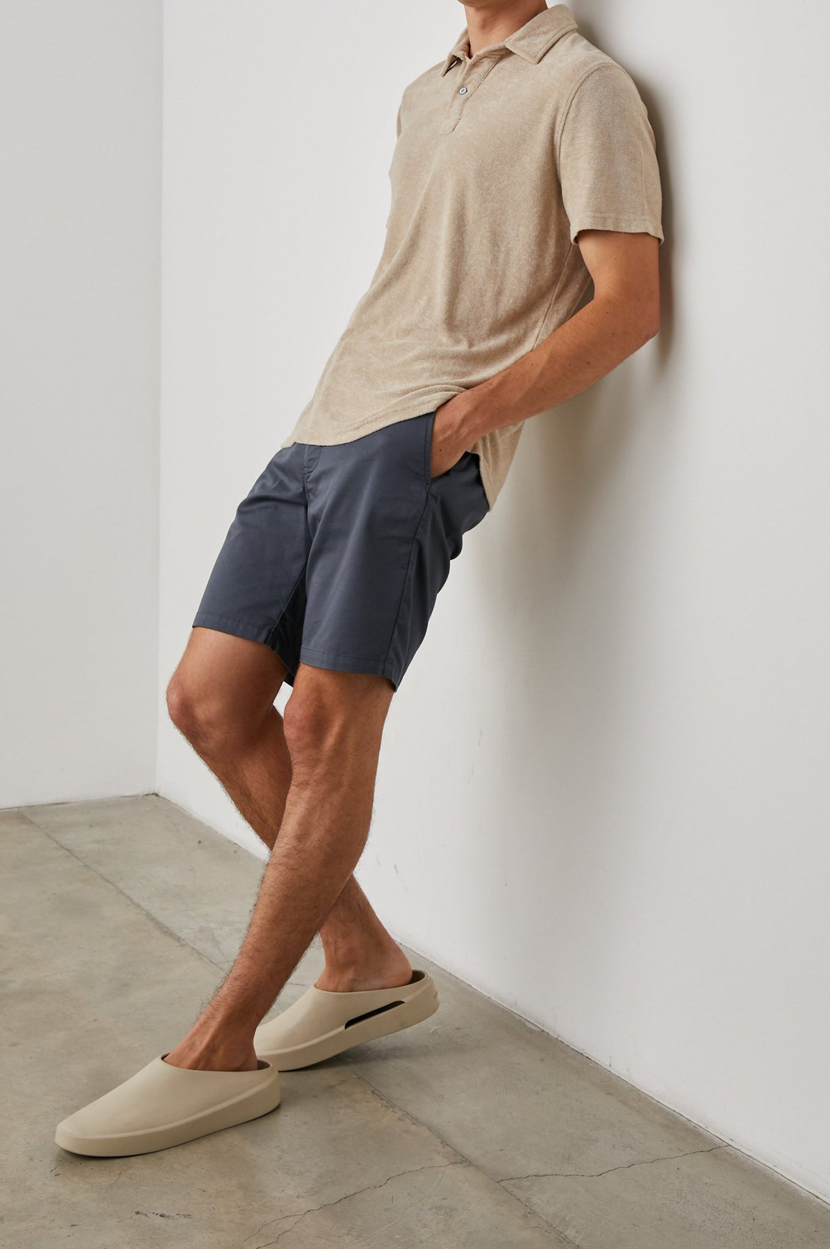 Rhen Short-Sleeve Polo Shirt with a Three-Button Placket in Chickpea Colorway - Front Full Body View Featured on Model