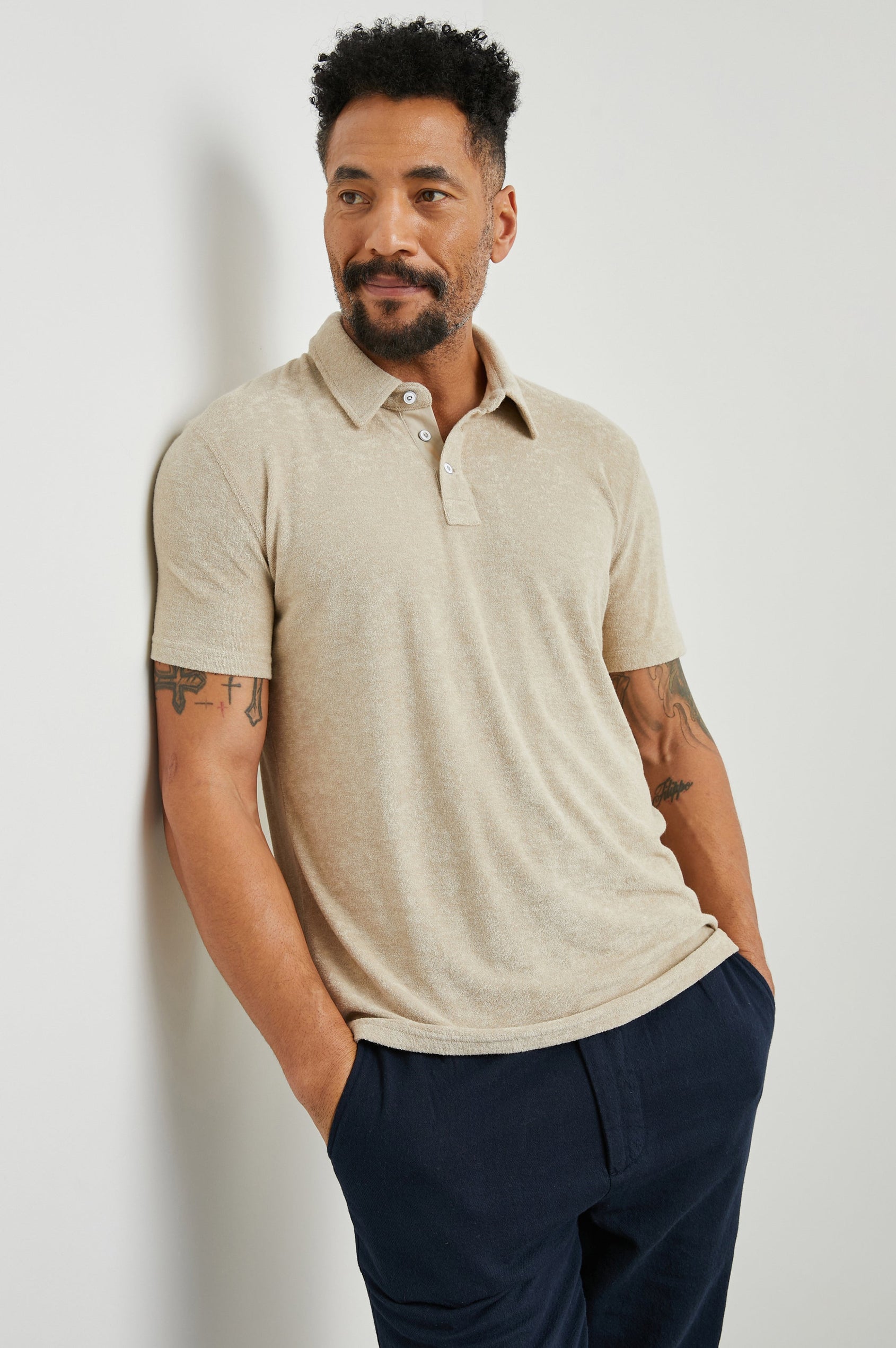 Rhen Short-Sleeve Polo Shirt with a Three-Button Placket in Chickpea Colorway - Front View Featured on Model