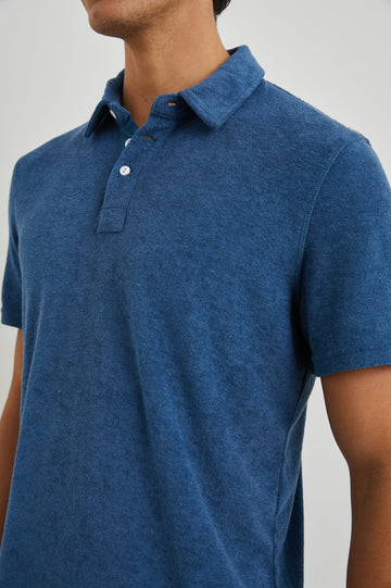 Rhen Short-Sleeve Polo Shirt with a Three-Button Placket in Ensign Blue Colorway - Front View Featured on Model