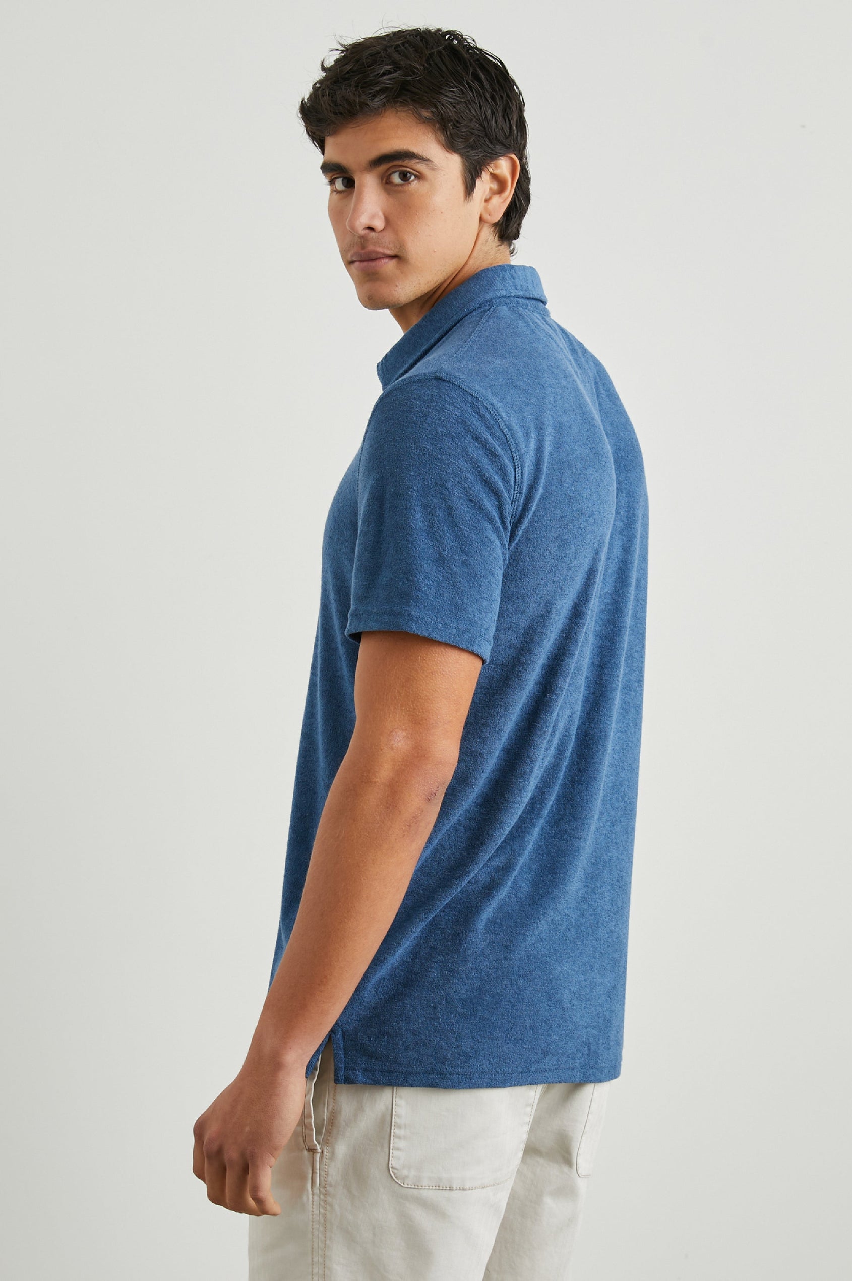Rhen Short-Sleeve Polo Shirt with a Three-Button Placket in Ensign Blue Colorway - Back View Featured on Model