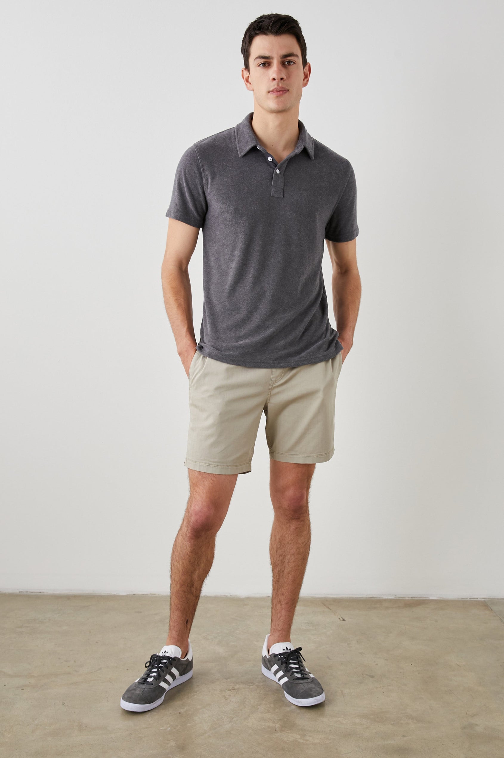 RHEN MACADAM POLO SHIRT - FRONT FULL BODY HANDS IN POCKETS