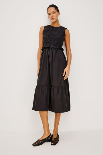 Rialto Midi Dress in Lightly Textured Poplin With Smocked Bodice, Ruffle Trim, Tiered Skirt, and Back Keyhole With Button-and-Loop Closure in Black Colorway - Full Body Front View Featured on Model