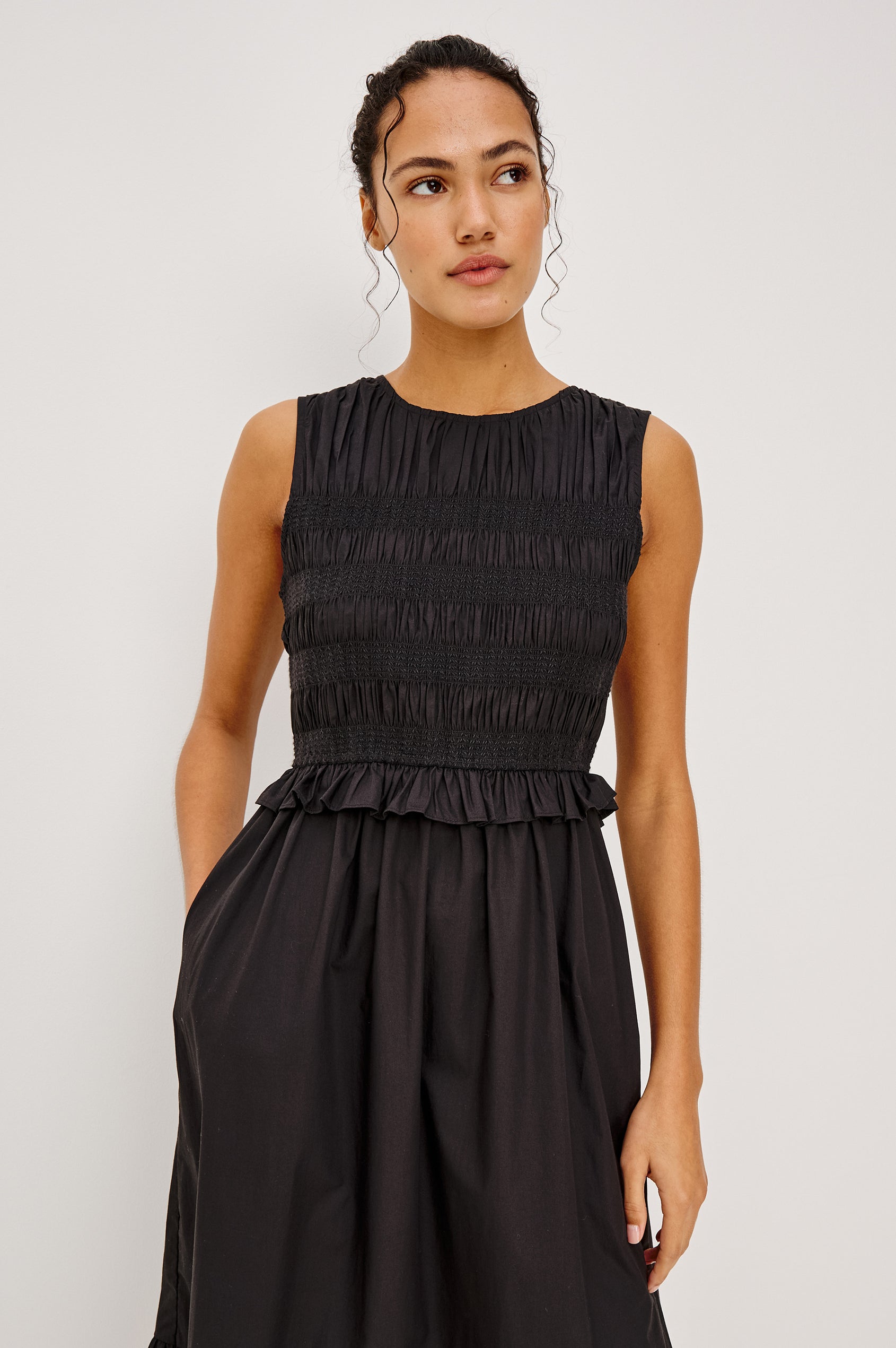 Rialto Midi Dress in Lightly Textured Poplin With Smocked Bodice, Ruffle Trim, Tiered Skirt, and Back Keyhole With Button-and-Loop Closure in Black Colorway - Upper Body Front View Featured on Model