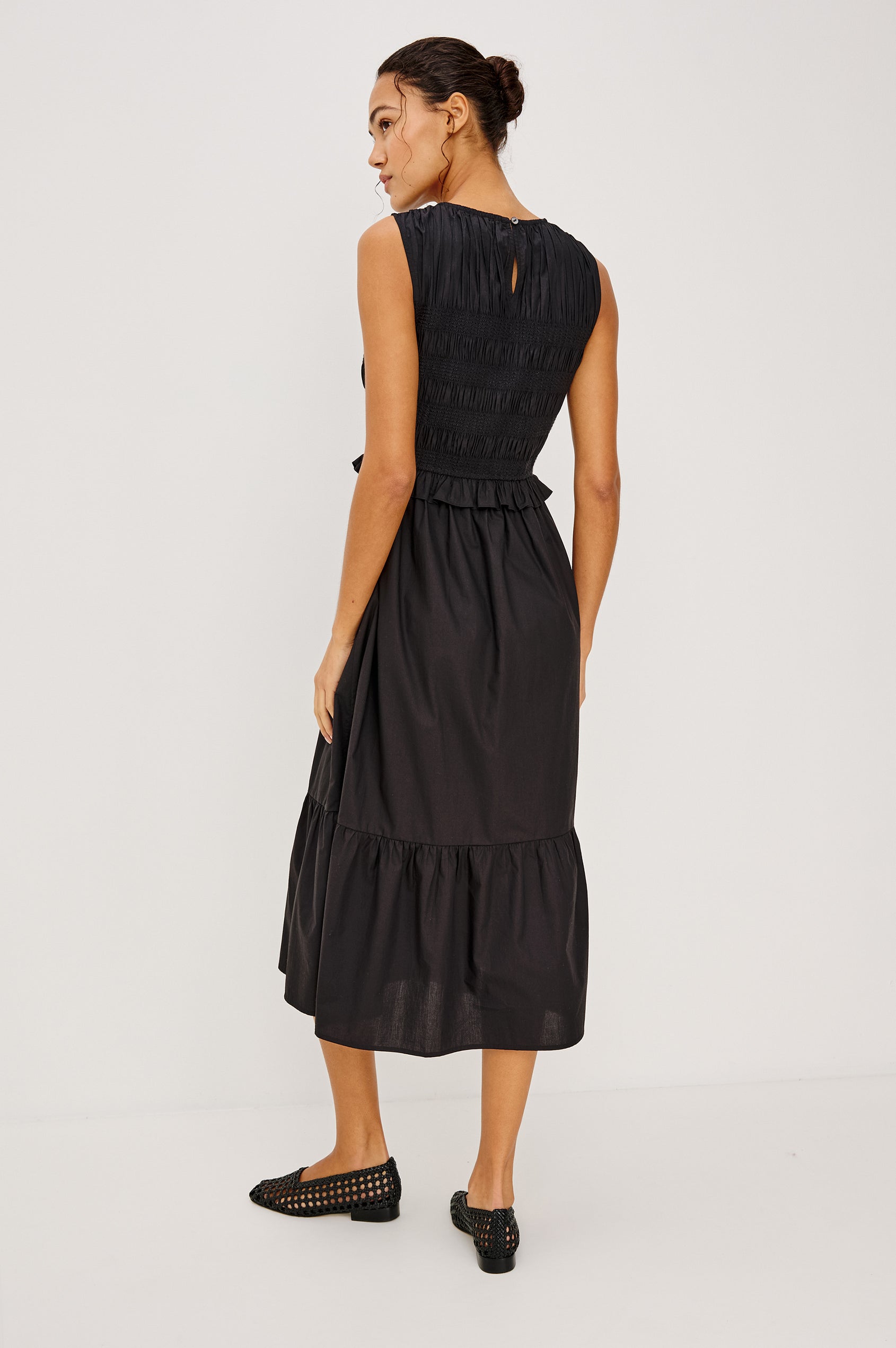 Rialto Midi Dress in Lightly Textured Poplin With Smocked Bodice, Ruffle Trim, Tiered Skirt, and Back Keyhole With Button-and-Loop Closure in Black Colorway - Full Body Back View Featured on Model