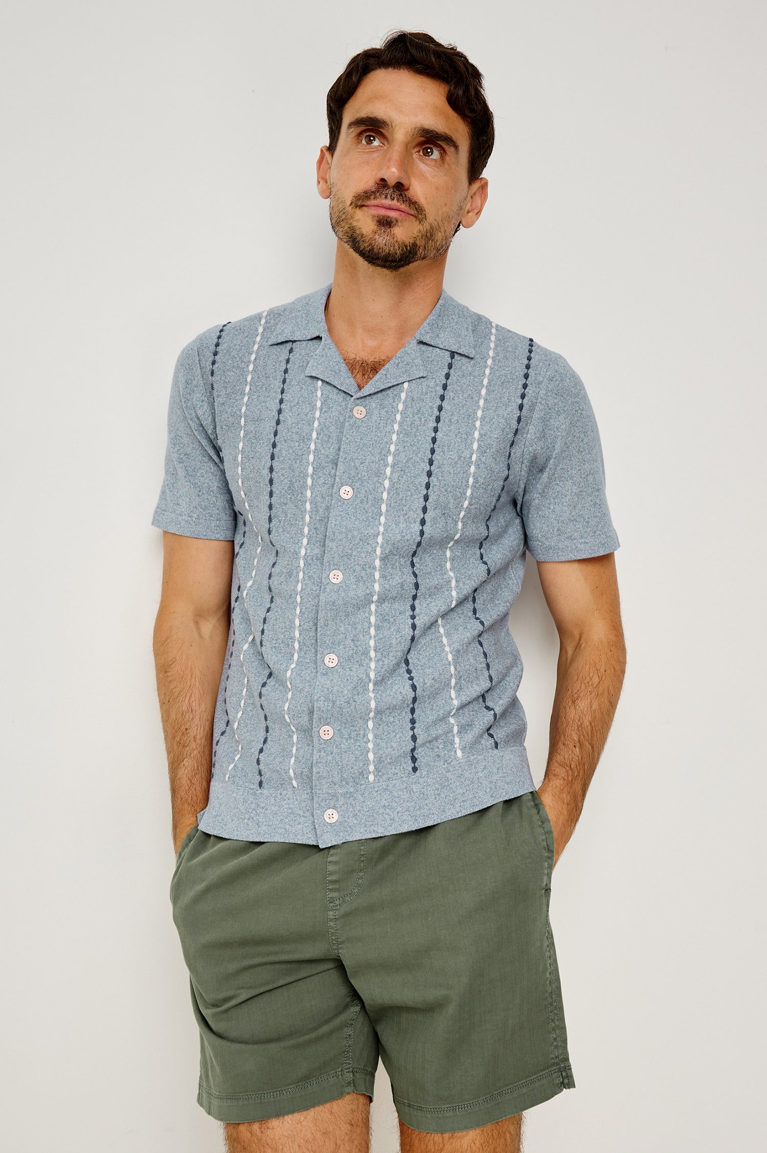 Richie Polo Shirt in Cotton Blend Knit With Collar, Front Buttons, Short Sleeves, and Classic Fit in Navy White Sky Colorway - Upper Body Front View Featured on Model